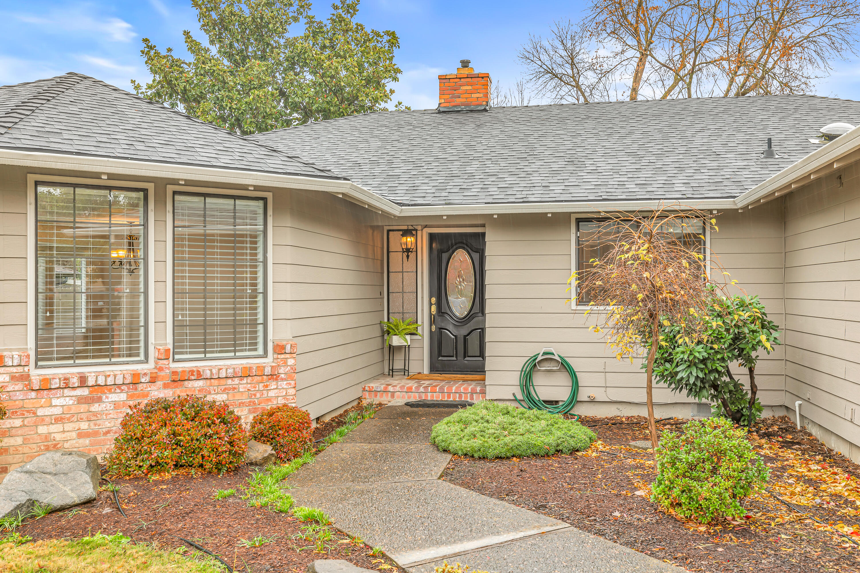 Located in desirable Lone Pine School District. Discover the perfect blend of comfort, style & convenience in this spacious 2275 sq ft, 3-bedroom, 2-bathroom well maintained home. Enjoy the separate living room with dining area and family room w/beautiful fireplace. The kitchen features plenty of storage with additional dining area, breakfast bar and opens up to the family room. Beautiful Hardwood floors throughout most the house. French doors open to large covered patio and spacious yard. Exterior access through the primary bathroom for your future hot tub, with hookups. Additional parking for boat or small RV. Large shop for work or storage. Whether you're a growing
family or looking for room to spread out, this home offers everything you need.
