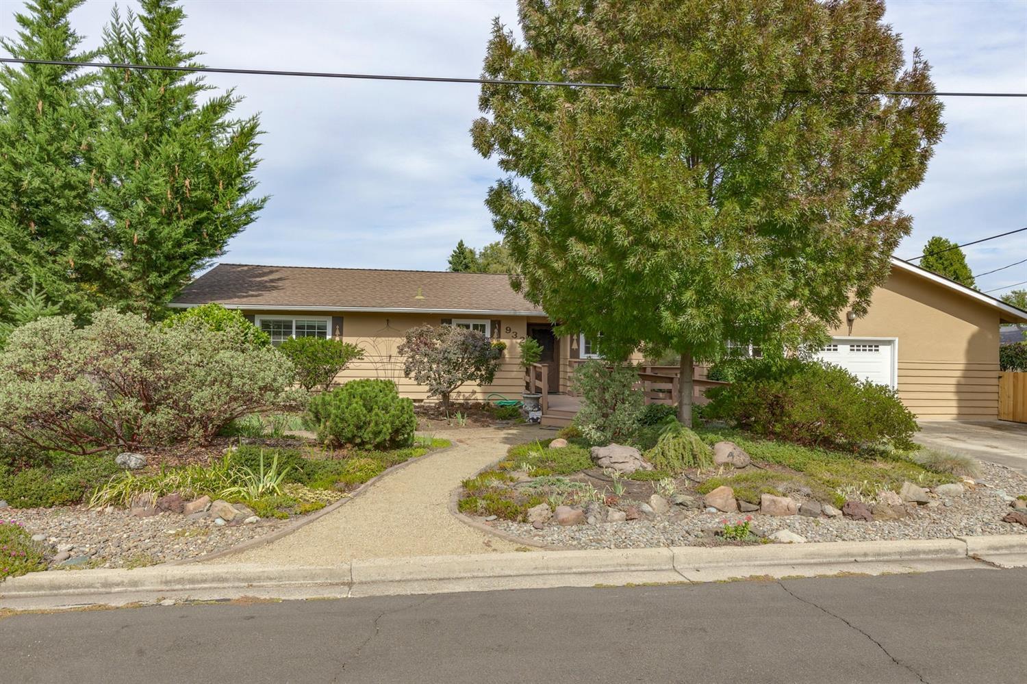 Be pleasantly surprised by this lovely home at the end of a dead-end street! Large .29 acre lot with vast and wonderful garden, ready for it's next green thumb! Home features 4 bedrooms, 2 baths, certified wood stove, and a very nice low maintenance landscaping around the home. Newer roof, newer carpet, newer vinyl floors, insulation upgraded in attic and crawl space, newer water heater, and high efficiency furnace. This home shows pride of ownership and has been well cared for over the years. Outdoor brick fireplace on the private covered patio to enjoy as well. There may be potential to split the lot. Call to tour this home today!