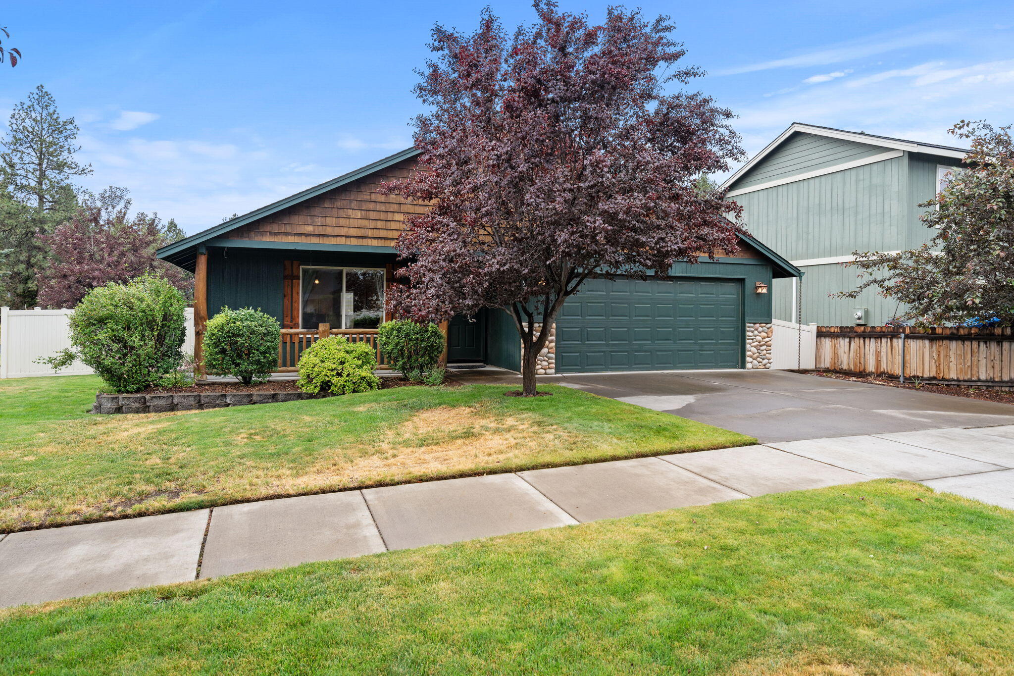Welcome to this well-cared-for 3-bedroom, 2-bath home situated on a spacious corner lot in a quiet, established neighborhood. This single-story property features an open-concept layout with vaulted ceilings and a cozy gas fireplace, creating a warm and inviting atmosphere for everyday living and entertaining. Recent updates include brand-new carpet throughout and fresh exterior paint. The kitchen flows effortlessly into the main living area, making it perfect for gatherings and family time. The primary suite includes a private bathroom, while two large additional bedrooms provide space for guests, a home office, or hobbies. Enjoy the comfort of central air conditioning and the convenience of a 2-car attached garage. This move-in ready home offers a great blend of comfort, character, and functionality. Call for your private showing today!