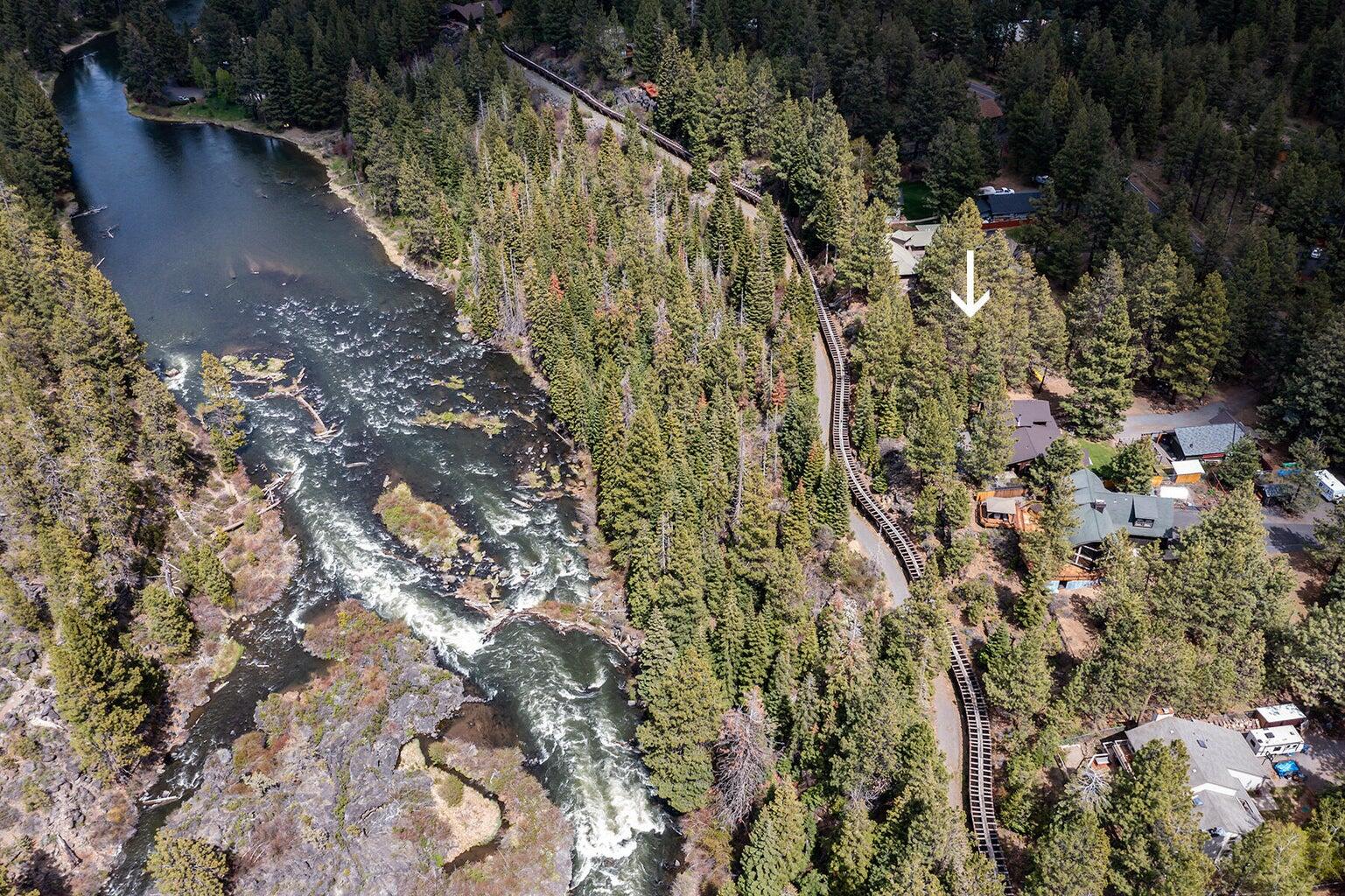 Create your ultimate haven on this prime .43 +/- acre lot bordering the Deschutes River and National Forest Land! Nestled in the trees with sounds of the river nearby, and surrounded by stunning residences, opportunities like this are rare. The level building site on a paved road offers many possibilities. You'll benefit from the Avion water access available at the street and the Arnold Irrigation flume at the rear of the property. Close to the conveniences of downtown Bend and tons of recreation. This is a must-see property!