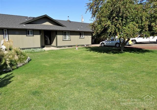 Must see this private oasis - 1 full acre with Cascade views(INCLUDES buildable sep tax lot!) Home has been completely updated with new roof, paint & vinyl windows. Interior features all wood floors & tile with superb master suite & tile deco walk-in shower. Upgrades include knotty alder solid wood doors & trim, stainless appliances & pellet stove. Enjoy mountain views from your private patio & yard. 2 car garage, plus large shop. All this just minutes to town!