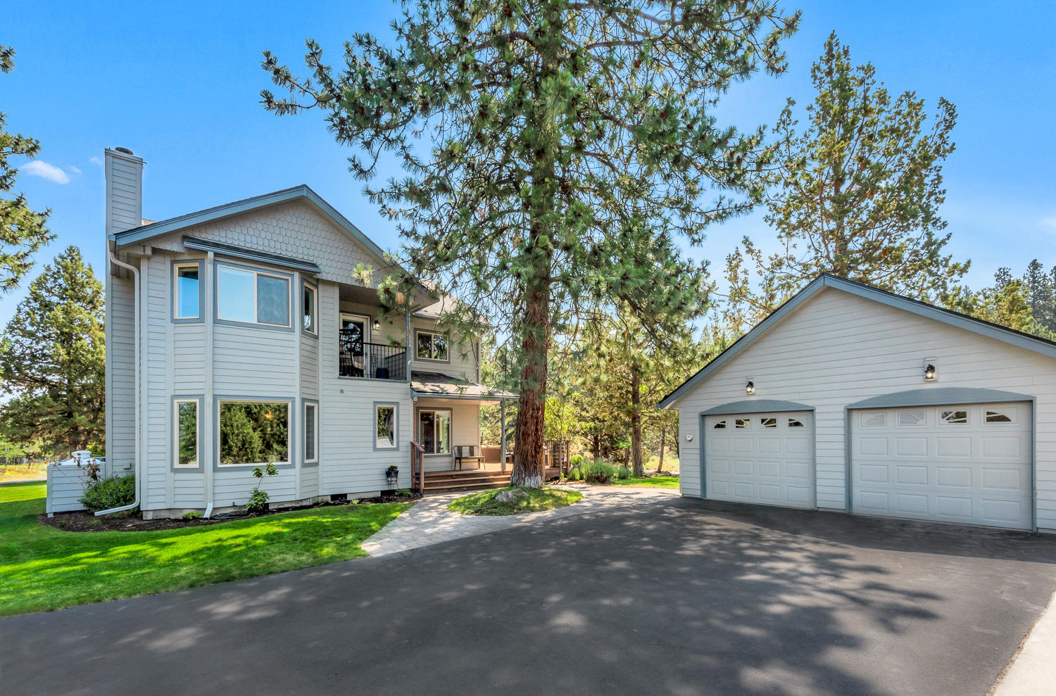 Just minutes from all of Bend's best amenities yet a world away from the hubbub, this updated Awbrey Meadows home awaits you. Mature Ponderosas grace the 1.34 acre lot surrounded by open space for a deep sense of privacy without isolation. Pride of ownership is reflected in exterior upgrades of new roof, siding, all new windows & exterior paint. Inside, chef's kitchen with butcher-block island, gas range, granite counters, dining area & wide windows overlooks a full-length 2 tier deck, perfect for gatherings. Two living areas, vaulted bedroom/office & full bath complete the main level. Well designed 2nd story features primary suite with lofty vaulted ceilings, private balcony, built-in cabinets & luxurious bath with dual head tile shower, granite counters. Also up, 2 guest bedrooms, full bath & 2nd balcony. 2 car garage & concrete RV pad provide ample parking. With updated bathrooms, new carpet, window coverings, window trim, interior paint & spray foam insulation, you need only enjoy!