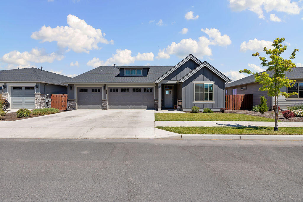 Why is this considered one of the best lot properties in Ochoco Pointe? Come take in the breathtaking views and you'll see why. This single-level Chase floor-plan boasts a  3-car garage, 3 bed, 2 full bath. Luxurious primary bedroom/bath wing with separate vanities and soaking tub.  Enjoy your morning coffee with unobstructed views of Barnes Butte or the unmatched sunsets that reflect off of it on your extended paver patio. Backing to walking trails and protected wetlands, you'll enjoy unmatched privacy with no future development behind. With the high end finishes Pahlisch is celebrated for, it's no wonder the Chase is a favorite. Tasteful dark stained wood cabinetry accented with modern hardware. SS appliances, coupled with a large quartz island and upgraded farm sink. Upgraded 6'' farm trim & light fixtures. Community amenities include a seasonal pool, acres of green spaces, front lawn care, kid park, and direct access to Barnes Butte trails. A truly rare opportunity, don't miss it!