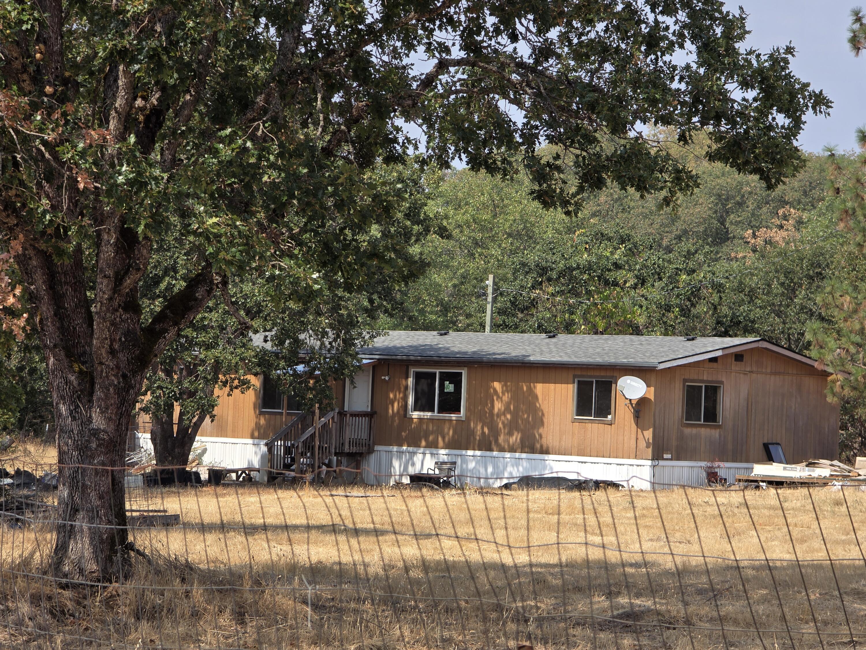 For the price of $ 260,000 for these 4.60 level acres, you can either replace the 1984 manufactured home or repair the double-wide that is on the property—room to plant a garden and room for animals. Call us to schedule an appointment for a must-see property. Holding tanks have been removed.
All information is deemed accurate but not guaranteed and subject to change at any time without notice.