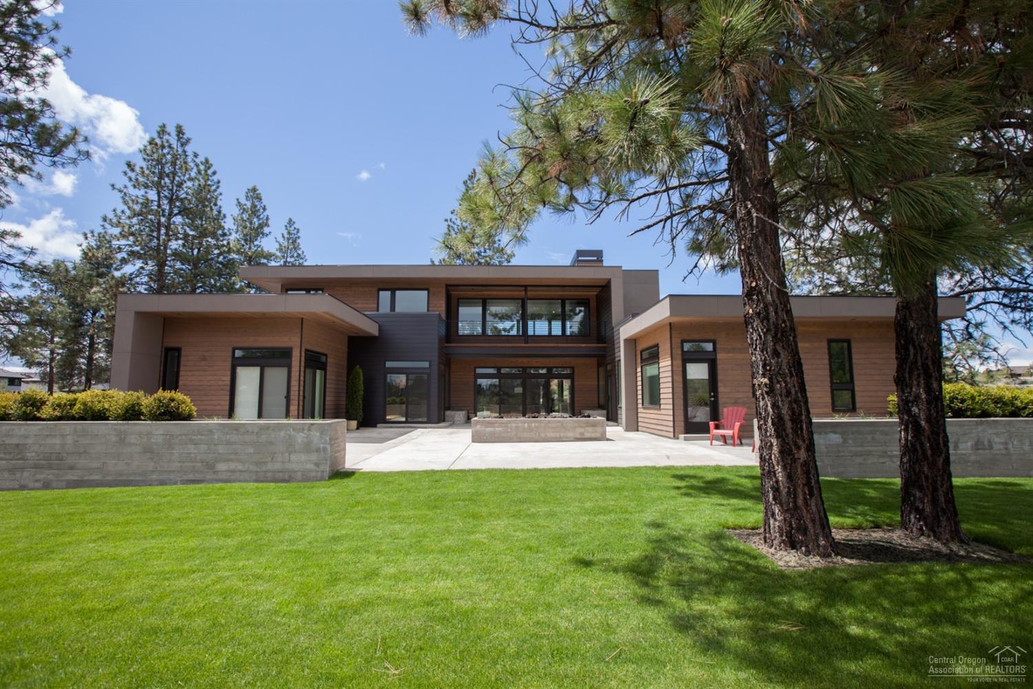 Newly completed bright & modern custom home on .93 acre lot in Tetherow. Chef's kitchen w/top of the line appliance package & butlers pantry. European oak wide plank hardwood floors, imported tile & solid surface counters throughout. Main level master spa suite w/heated floors & walk in double master closet. Single level living with the master, two bedroom suites, office & 4+ car garage on the main level. 3 outdoor living spaces w/the large East courtyard encompassed by privacy berms facing the #12 green.