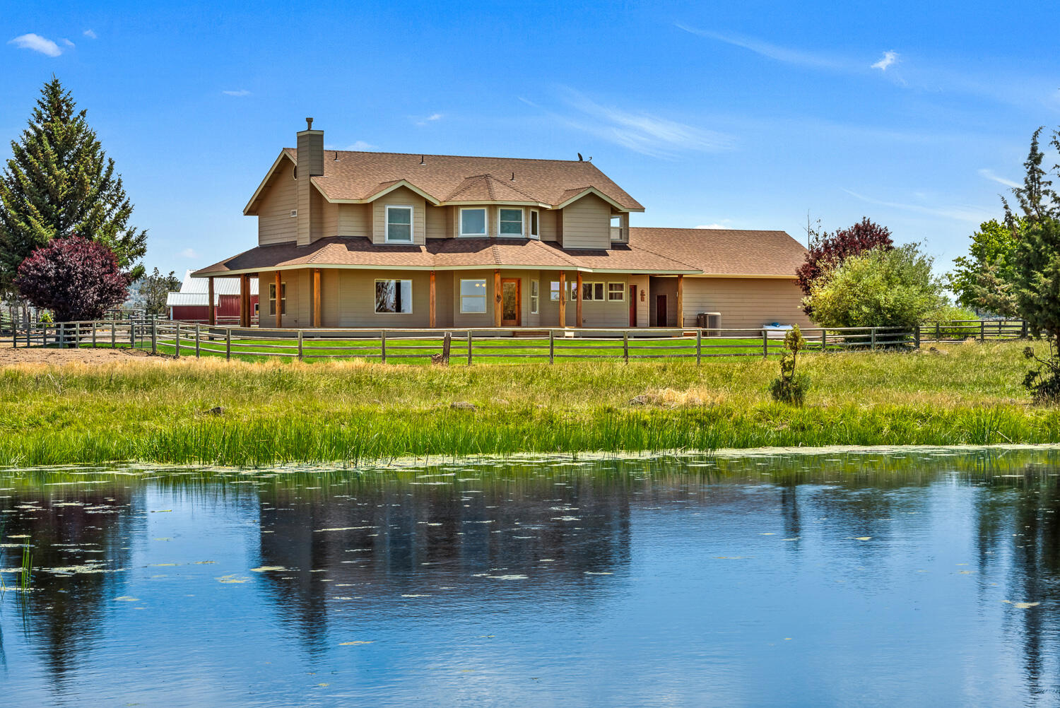 Enjoy the Cascade Mountain, Smith Rock views in your own quiet setting. 74 ac with beautiful home & 54.17 ac irrigation provide a great country lifestyle. Complete with shop/barn, hay shed and corrals, this is a great opportunity for a family to have livestock & 4-H projects. The property is set up for livestock & horses including a shop/barn with horse stalls with doors for future turnouts if desired. It is nicely sloped for flood irrigation with water provided by a district & there is also tail water from upstream irrigation. 3,348 square foot home with wrap around porch, 4B/3.5B with nicely appointed kitchen. There's a Laundry/Mud room with bath, Office space, Study or Media room. A great place for a peaceful country lifestyle.
