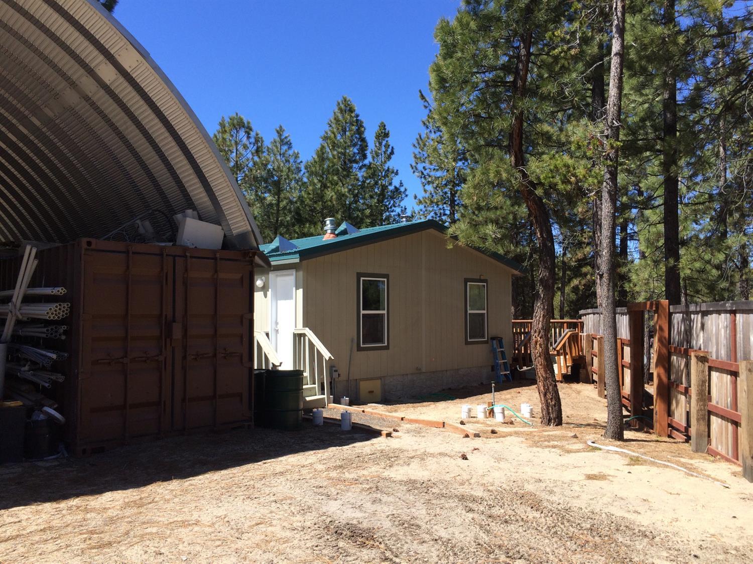 Amazing Prepper property! If you're looking for someplace to bug out to or want to live away from it all, this is the place for you. Built with surviving TEOTWAWKI, the property has a 864 sq. ft. double wide manufactured home on 9.12 acres of rural land. A 1640 sq. ft. domed building which has 2 40' long conex type storage container in it provides RV parking and storage. Another 40' long conex type storage container is partially buried and insulated to provide for long term, rodent resistant food storage. 2 1000 gallon propane tanks provide for cooking, water hearing and back up heat to the wood stove. Near USFS land with a nice river (Sycan River) leas than 2 miles away. Fishing and hunting abound in the area. There are 7 RV sites all with water hook ups and 6 with sewer hook ups. The property is eligible for an accessory dwelling unit.