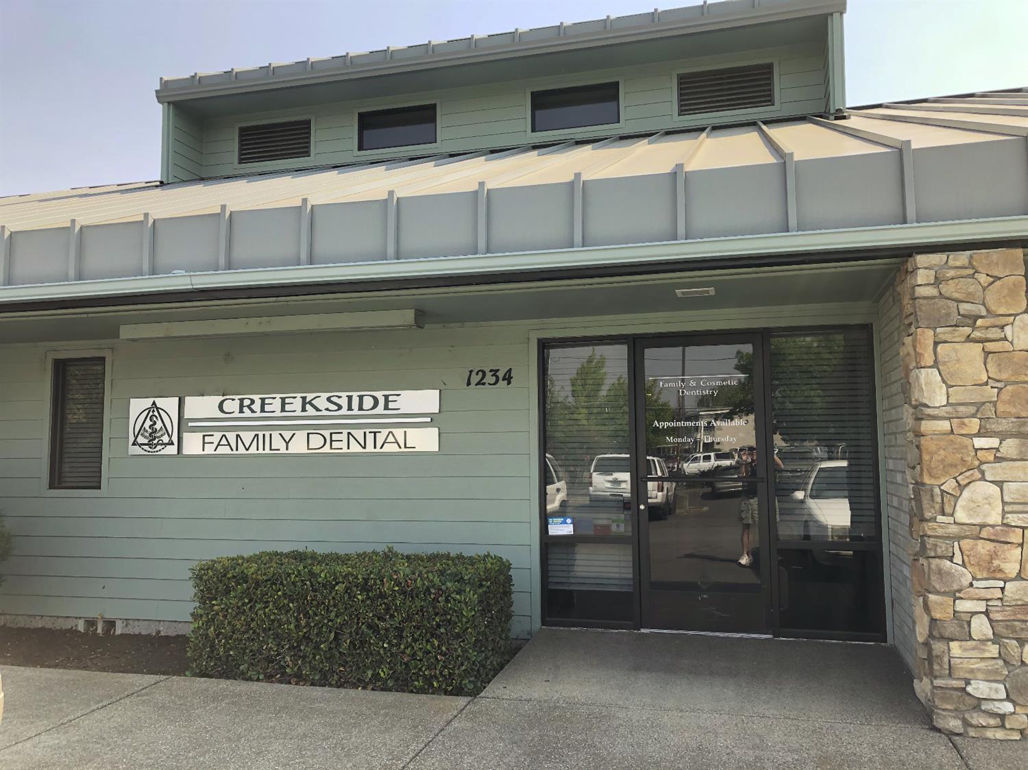 Successful dentist office available due to retirement of owner. Well-maintained and well-located office condominium of approximately 2,500 SF, plus additional approximately 990 SF of two rental units at the lower level that produce about $1400/mo. in gross income. This 6-operatory dental clinic was built in 1995 and recently renovated to be ready for modern dentistry in every way. The clinic architecture includes high vaulted ceiling, great lighting, modern casework and built in communication system. Each operatory is computer ready and equipped with N20 and oxygen. The small group of owners within this 5-unit condominium development share cost of parking lot maintenance, garbage, water, etc. The location is just south of the Rogue Valley Mall, and a few minutes to the north I-5 Interchange. Please see floor plan of dental clinic included.