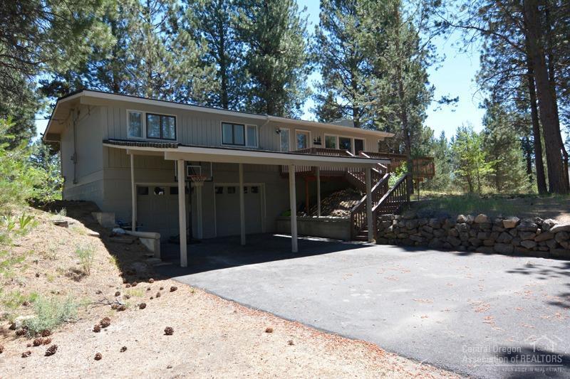 Recently remodeled single level living home on .52 acres. Close to Sunriver, Mt Bachelor & Cascade Lakes. Picture windows in the living room looking out to mature ponderosas, wood floors, attached 2 car garage, paved driveway. Room for a shop.