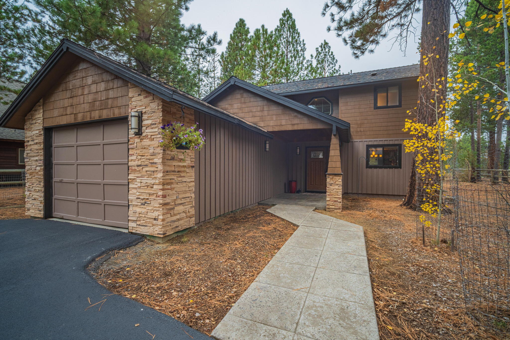 Welcome to this beautiful Riverfront Property boasting well established ponderosa pines in a prime location on the Big Deschutes River! Recent Professional carpet cleaning/stretching throughout & newly updated closet doors in primary bedroom. 3 bed,2 full bath w/a spacious loft that can be utilized as a desk/office area. Picture yourself paddle boarding, floating or kayaking the river off your own personal dock.  Just minutes away from Sunriver Resort, surrounding lakes, hiking trails, bike trails, and fly fishing on the Fall River. Take a quick drive up to Mt Bachelor to enjoy all of your seasonal adventures! This leveled .58 acre lot has a long inviting paved driveway with RV hookups, plenty of parking spaces and a bonus 1080 sq. ft Farm Building. The Farm Building includes a dedicated heated/cooled crafting room that could also be used as an office. Don't miss your chance to own this thoughtfully landscaped home nestled quietly in Oregon Water Wonderland!