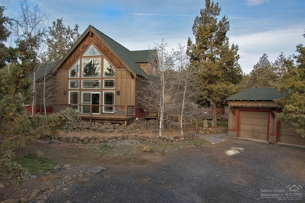 Charming Chalet on 1.96 Acres w/panoramic Easterly views, Must see to appreciate! Quality Craftsmanship throughout, Floor-Ceiling windows, Open Great Rm, Loft, Hardwood floors, built in shelving, New carpet & paint, Mstr on Main, walk in closet, private courtyard, front deck, Fully fenced /cross fenced w privacy gate, perfect for pets or horses. Garden Area, Greenhouse, outbuildings, Water feature, Tree swing, horseshoe pit, 2 car garage. Mature trees & convenient location 10min to Bend or Redmond.