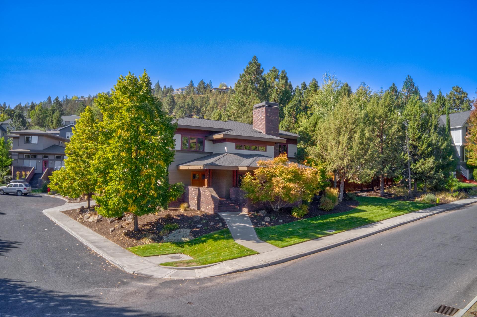 Stunning prairie-style home on a cul-de-sac in the desirable neighborhood of Awbrey Village. Freshly updated this year with new kitchen, bathrooms, hardwood floors,
carpet, interior paint in baths, fixtures and new roof in 2018. You'll love the open floor plan, vaulted ceilings, exposed wood beams, brick fireplace and several access points to expand living to the outside. This property also features a roughly quarter acre corner lot with expansive fenced backyard, mature tress, several covered outdoor living areas, and an oversized garage with storage/shop area. You've got to see this home! Seller is licensed realtor in the state of Oregon.