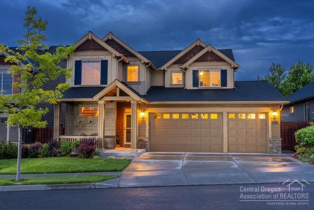 Immaculate craftsman home in Ochoco Pointe with stunning pastoral views of Barnes Butte & open spaces. Nicely appointed 3bd, 2.5ba plus bonus room, could be 4th br - has closet, 2174sf w/spacious kitchen, pantry, eating bar, tiled counters, hickory floors and abundant natural light. Master on main level. Living room enhanced with custom built ins, rocked wall w/gas fireplace w/red alder mantle, slider opens to beautifully landscaped outdoor living area, fenced for privacy. Triple garage w/ shop area.