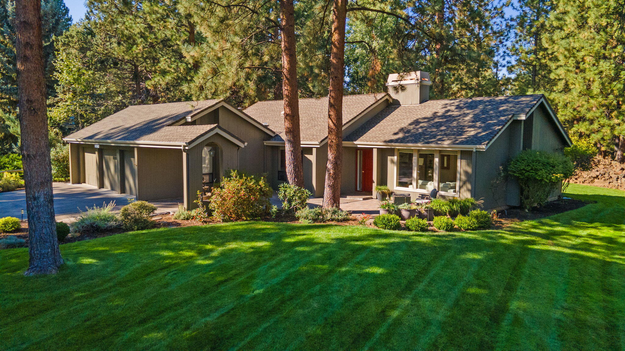 Located on a premier .53/ACRE corner lot in the gated SE Bend community of Mountain High, this SINGLE LEVEL gem features a true park-like setting & a thoughtfully designed home. Welcoming front entrance leads to light-filled Great Room w/vaulted ceilings and a wall of windows overlooking the stunning landscape. Spacious Chef's Kitchen offers stainless steel appl & ample cabinetry & opens to informal dining area w/direct access to expansive back deck for seamless indoor/outdoor entertaining. Formal Dining area w/ views of backyard and mature foliage. Primary Suite with walk-in closet and back deck access. 2 additional BR (one currently used as home office w/built-ins and french doors) + full Bath. Exquisite backyard OASIS, ideal for gathering or peaceful relaxation under the Central Oregon skies. 3 car garage for all your Bend gear. Step out your front door & enjoy wonderful community amenities including pool, 4 pickleball courts, 2 tennis courts, park & pavilion & Old Back Nine Golf Course.
