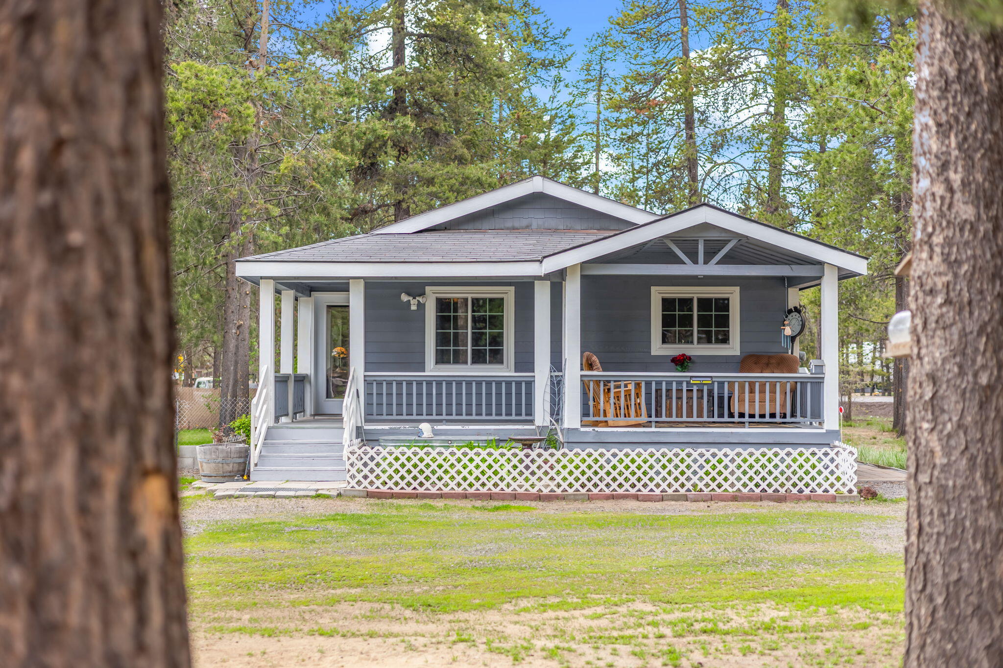 Start your day with coffee on the covered porch, garden in the optional 14'x24' greenhouse, or let pets run in the fenced yard—all from this beautifully maintained 3BR/2BA home on a full acre. Just 1 mile from La Pine State Park and the Deschutes River, outdoor adventure surrounds you with lakes, trails, fishing, paddling, and more. Recent upgrades include a brand-new well, fresh interior & exterior paint, new flooring, an updated primary bath, and triple-paned Dabella windows with a lifetime warranty. Bright, inviting, and move-in ready, this home is a must-see! A detached 2-car garage, shed, and ample parking make it easy to store all your gear. With paved road access, STR eligibility, and quick trips to Sunriver, Quail Run Golf, and Bend, this property offers incredible value and the perfect Central Oregon lifestyle. **1% Lender Credit Available with Preferred Lender**