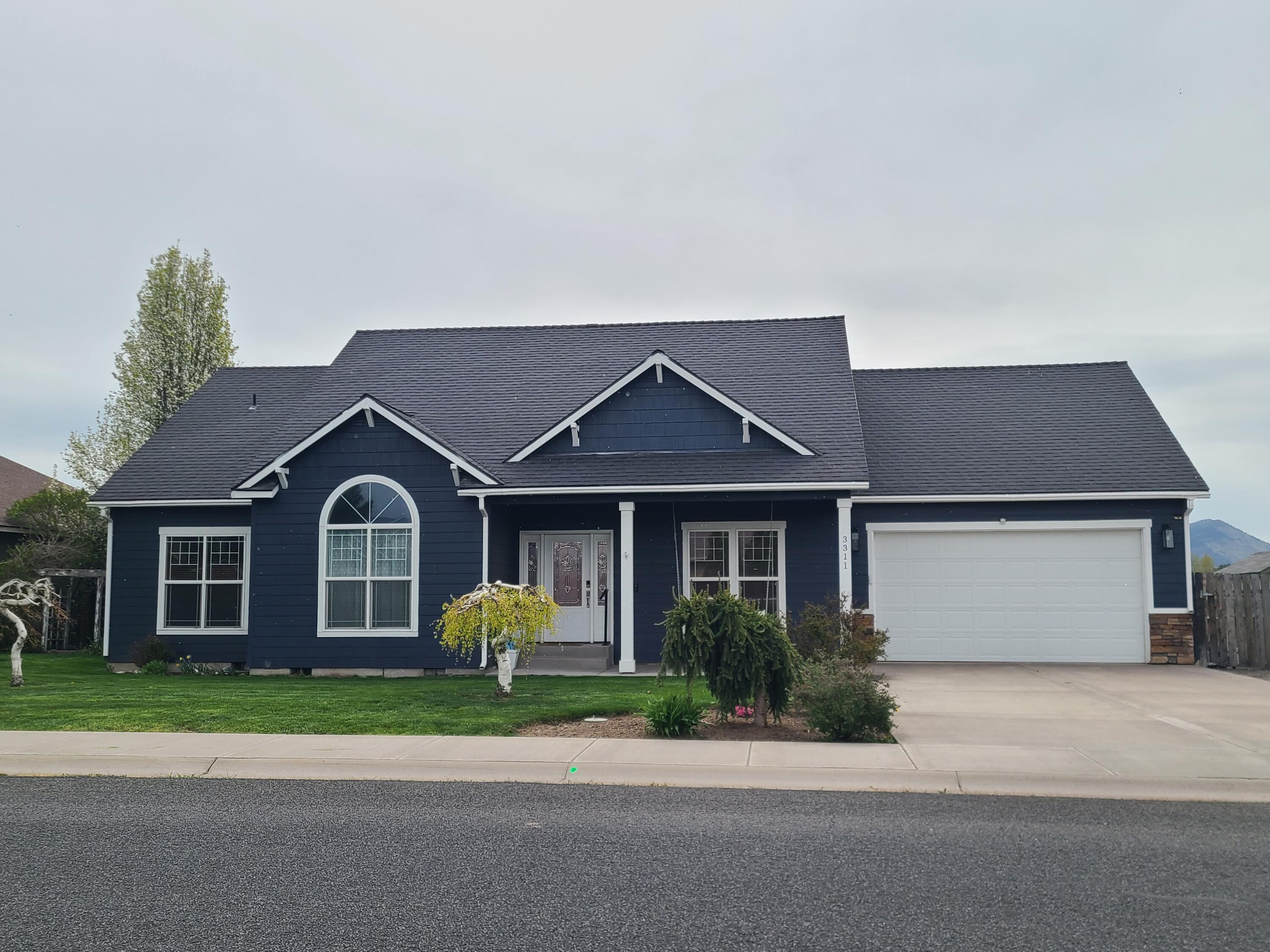 Many upgrades to this open and light-filled home including newer stainless appliances, luxury vinyl floors throughout, fresh paint, and solid-surface counters. This home features a lovely split floorplan, high ceilings, gas fireplace, a master with a tiled walk-in shower and a walk-in closet, plus a second bedroom with vaulted ceilings and a walk-in closet. Outside enjoy the covered patio with unobstructed views, and a storage shed. This is a beautiful home sure to please.
