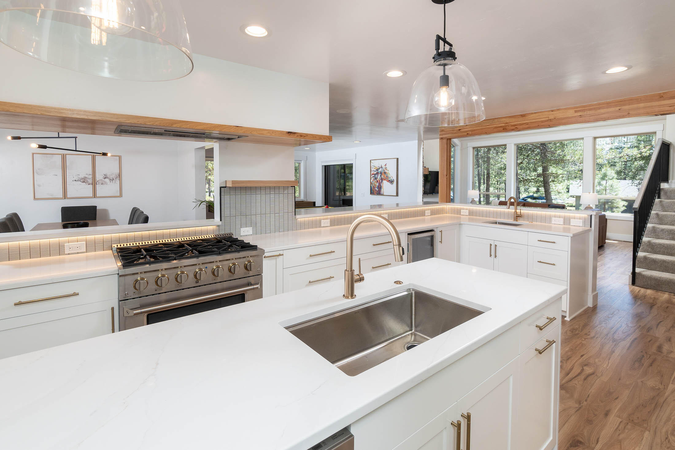 Top-to-bottom high-end turnkey renovation on one of the best lots in the heart of Sunriver! Situated on the 14th fairway of the Woodlands golf course, a short distance to Ft. Rock Park & next to large common area. Enjoy incredible privacy, peace & quiet out on the back deck & hot tub. Inside, welcome to a beautifully curated down-to-the-studs remodel. Designer gourmet kitchen w/ quartz counters, new custom cabinetry & professional grade 36'' gas range. Great room off kitchen w/ vaulted ceilings & new rock/gas fireplace. 2 bdrms/suites on the main level. The luxurious primary bdrm includes gas fireplace, tile shower, heated floor & twl rack, and large walk-in closet. Upstairs you will find 3 addn'l bdrms, 2 full baths, plus bonus room. New remodel highlights: kitchen, addn'l bath, furnace+A/C, wtr htr, EV charger, SMART home equipped, 3 gas fireplaces, electrical, plumbing, lighting, floors, solid core knotty alder interior doors, interior/exterior paint, new furnishings and much more.