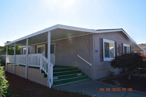 Very clean 1988 2 bedroom 2 bathroom Golden West manufactured home in West Lake Village, a 55+ community. You will be impressed with how this seller took care of her home. There is a wonderful large covered front deck for entertaining or just feeling the breeze'' whisper through, as you enjoy your morning coffee and an evening drink and visit with the neighbors on their walk. Two bedrooms, where the master suite includes a walk-in closet and its private bathroom. Then there is the second large bedroom and a guest bathroom. The kitchen includes all appliances and is ready for your next batch of cookies. You have a carport for your vehicle and a back yard that has trees, flowers and shrubs to create a relaxing and enjoyable time working there or just enjoying the day. Come by and see this well maintained and enjoyable home. You may just say, Let's buy it!