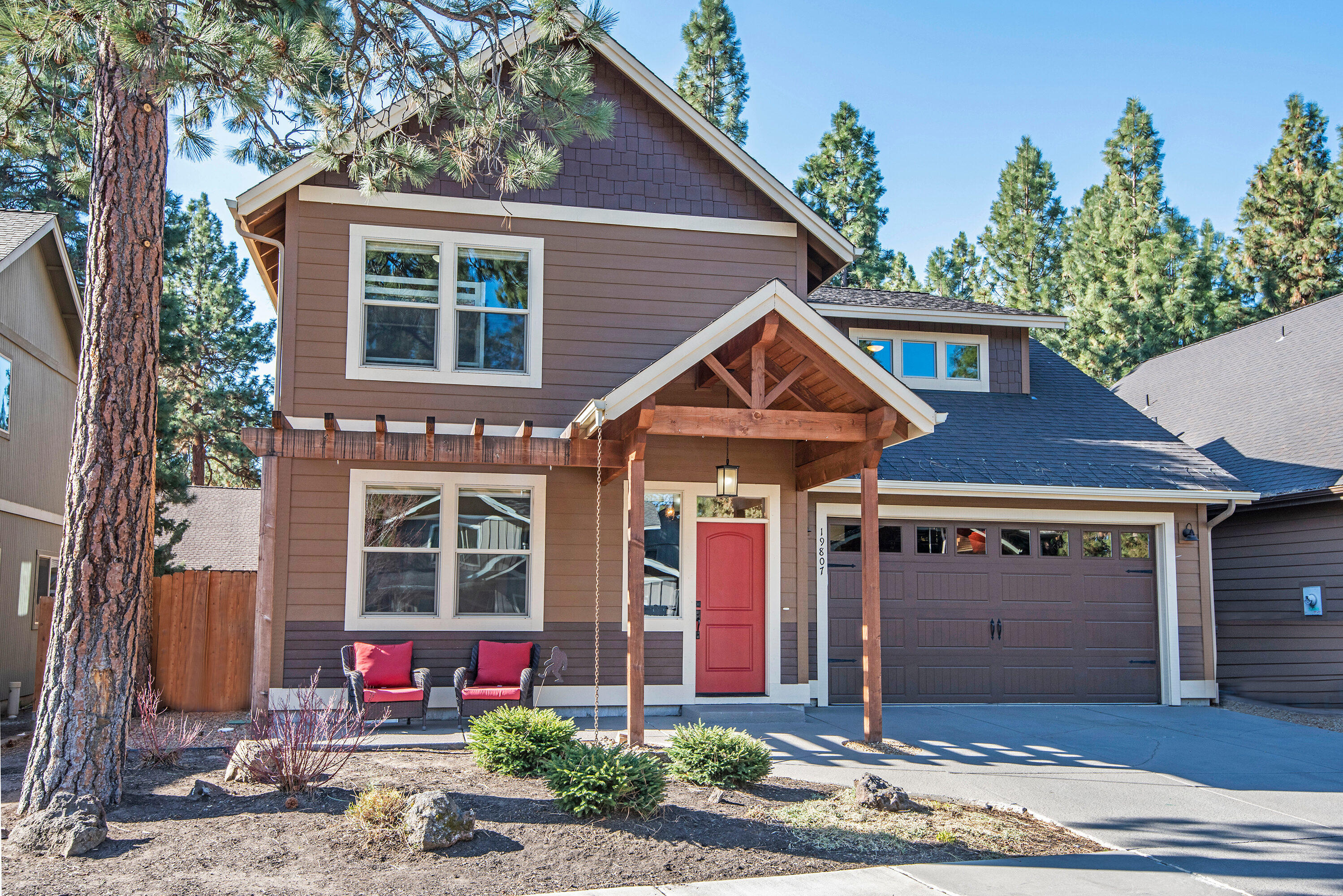 Beautiful turnkey, multi-generational home minutes from Downtown Bend, Old Mill, only 7 houses from Deschutes River Trail access, walking distance to Pine Ridge Park & School. 2 doors from the Pit and NO HOA fees. Interior features an in-law suite downstairs with private entrance & second primary bedroom upstairs. Bonus room with an ensuite bathroom upstairs could be used as a bedroom. Home features natural edge granite countertops, stone fireplace, formal dining & living area built-ins, breakfast nook with bench storage, glass door kitchen cabinets, hardwood floors, tiled bathrooms, new dishwasher, above garage & wall hanging storage, tankless water heater & central AC. Open floor plan with large windows throughout. Backyard boasts a covered patio, fire pit, treehouse, flowerbeds, gardening shed & 10x16 Better Built Barnes shed. According to City of Bend home eligible for STR permit. Come be a part of a great neighborhood and close to all Bend has to offer.