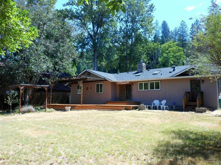 Lovely creekside setting on this recently remodeled rancher with river rock accents, bay window, deluxe lighting controls, gas log fireplace, generous use of skylights along with lots of windows and a beautiful French slider out to an expansive deck overlooking East Evans Creek make this a home that will surely please even the most discriminating buyers at this price point.