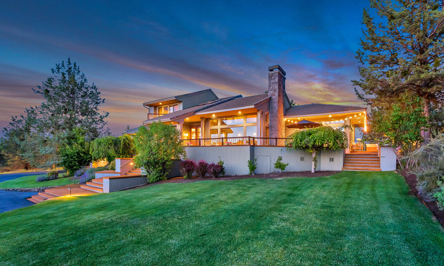 Rare find in this exquisite home offering Cascade Mountain Views and sitting on over 5 acres. This 3455 sqft, 4 bed/4.5 bath home has dual master suites, a formal living room, large family room, both formal and informal dining areas and a sunroom. Kitchen is complete w/ dual ovens, island, pantry, wet-bar, counter seating, and opens to nearly 2500 sqft of brand new decking ideal for entertaining, including a personal putting green. Attached oversized 3-car garage, a newer 36x48' RV/shop, and additional covered parking. Carpet is new throughout, new heating system, freshly poured concrete, all new gravel/walkway paths, new toilets, and outside deck make this an awesome opportunity to have the perfect home in Bend/Tumalo.