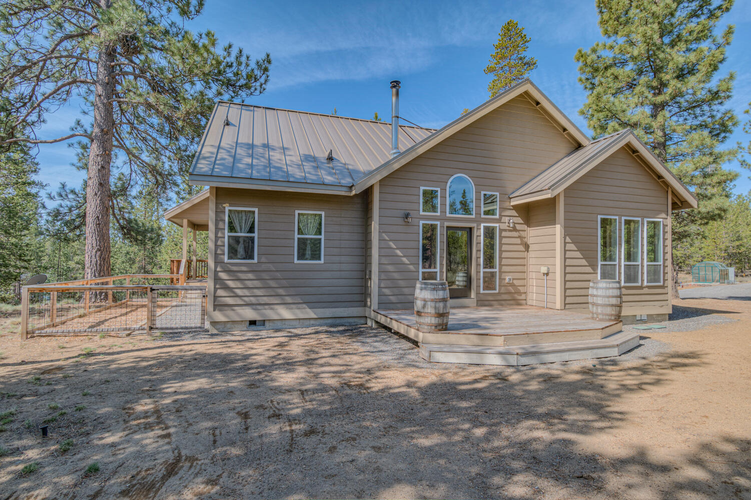 Discover modern mountain living in sought-after Fall River Estates! Tucked on a peaceful 1-acre lot just steps from premier fly fishing, this beautifully maintained home offers privacy, elegance, and comfort. Inside, enjoy granite countertops, slate flooring, and high-end stainless steel appliances. Vaulted ceilings and an open layout create a bright, airy feel, while the main-level primary suite adds ease and luxury. Unwind on the expansive wrap-around porch, perfect for soaking in the tranquil forest setting. A true Central Oregon gem—schedule your private tour today!