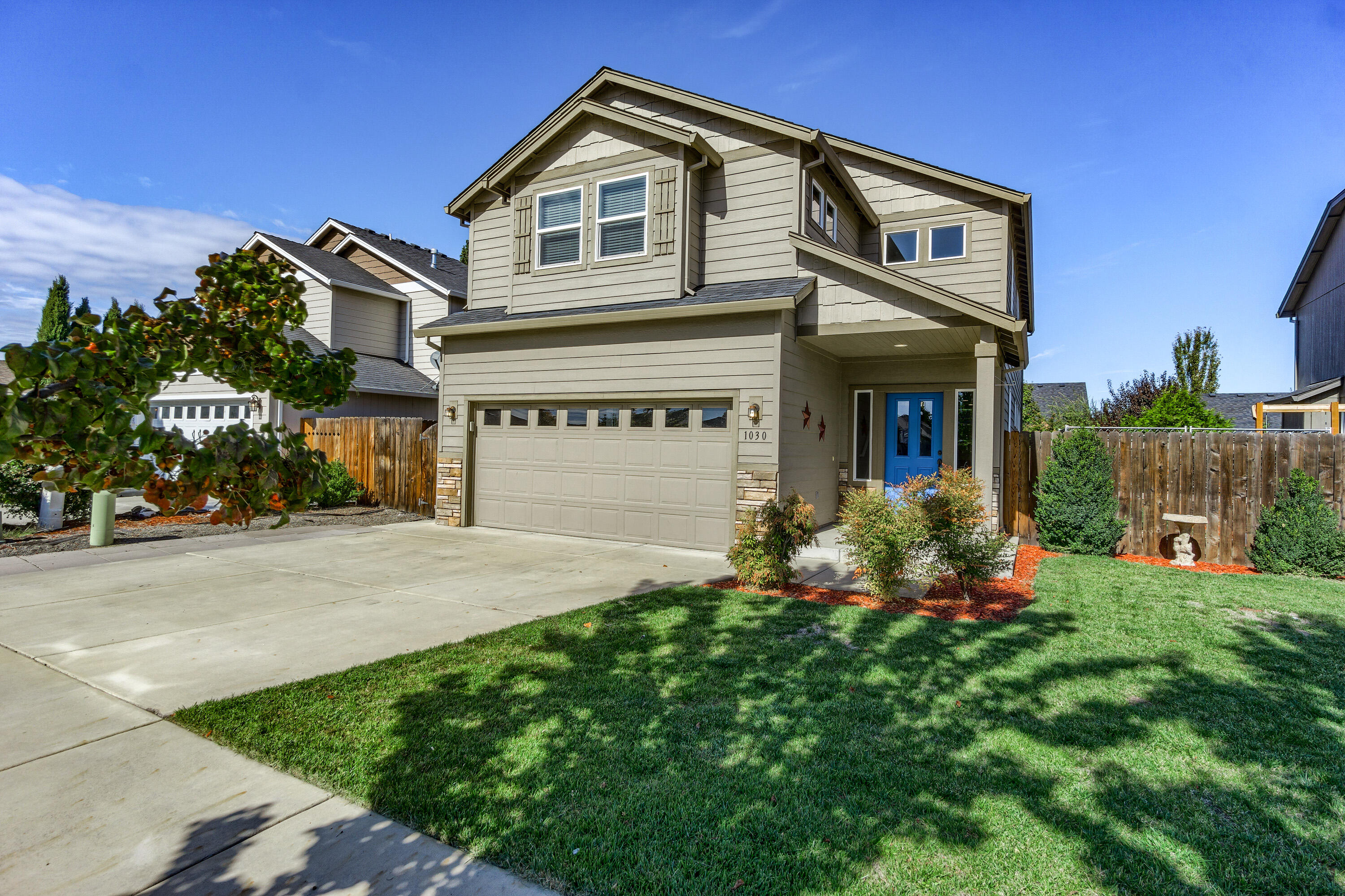 Move in Ready! This Beautiful 2 story home has been well maintained & is ready for you to get settled in before winter. Gorgeous Kitchen has white cabinets, stainless appliances, gas cooking stove, tile flooring & pantry closet. Dining room has sliding glass door leading to covered patio & brings in lots of natural light. Gas fireplace in cozy family room. Spacious Primary Bedroom with en-suite primary bathroom & walk in closet.  3 Bedrooms & 2 Bathrooms on 2nd Floor along with a large Bonus Room with multiple uses like office, play/hobby room, etc. Half bathroom & laundry room on first floor. Laundry room has large folding counter & cabinets above washer & dryer area. Covered back porch with fenced back yard perfect for outdoor entertaining. 2 car garage. Fantastic Neighborhood & Central Location, minutes to Jacksonville & Central Point.  Close to Park, Outdoor Activities, Shopping, Restaurants, Schools, Medical &Airport. Home has already been professionally cleaned & is ready for you