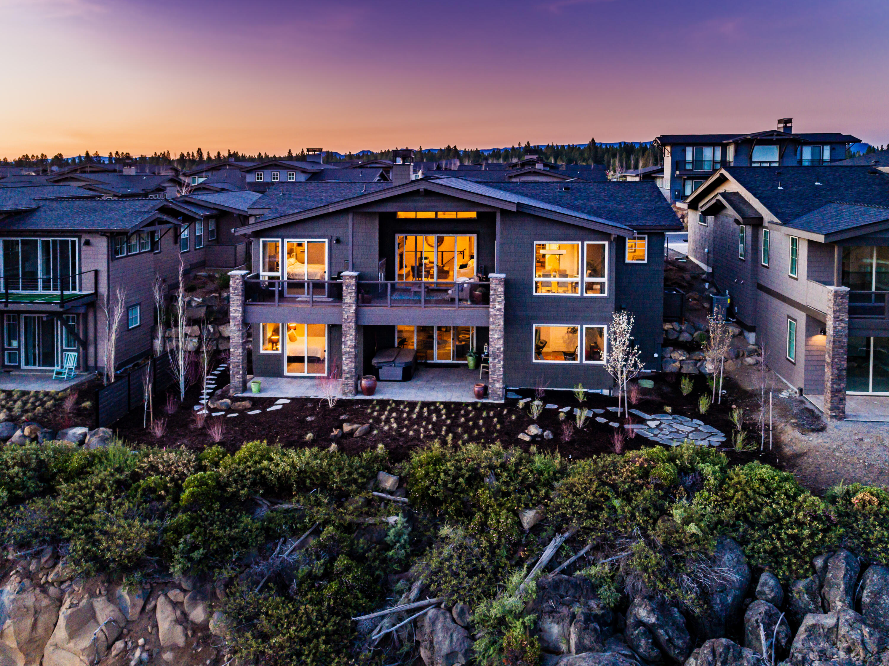 Beautiful, upgraded home situated on a premier view lot at The Rim at award-winning Tetherow Resort. This stunning home features many upgrades including an enlarged Primary Suite with a very spacious Walk-In Closet, Spa-like Bathroom, Fireplace and huge Cascade Mountain Views. The spacious floor plan is also enlarged in the laundry room area providing a more inviting space. Other upgrades include custom blinds throughout, double ovens, garage built-ins with a large work bench, extra closet systems, and acid stained concrete floor in the garage. The large, open floor plan features main level living including the enlarged master suite, another guest suite, office, laundry and open kitchen, living and dining room all overlooking the beautiful views, with an extra 2 guest suites downstairs, large 2nd living area and tons of storage! This home is truly turn key and ready to be enjoyed.