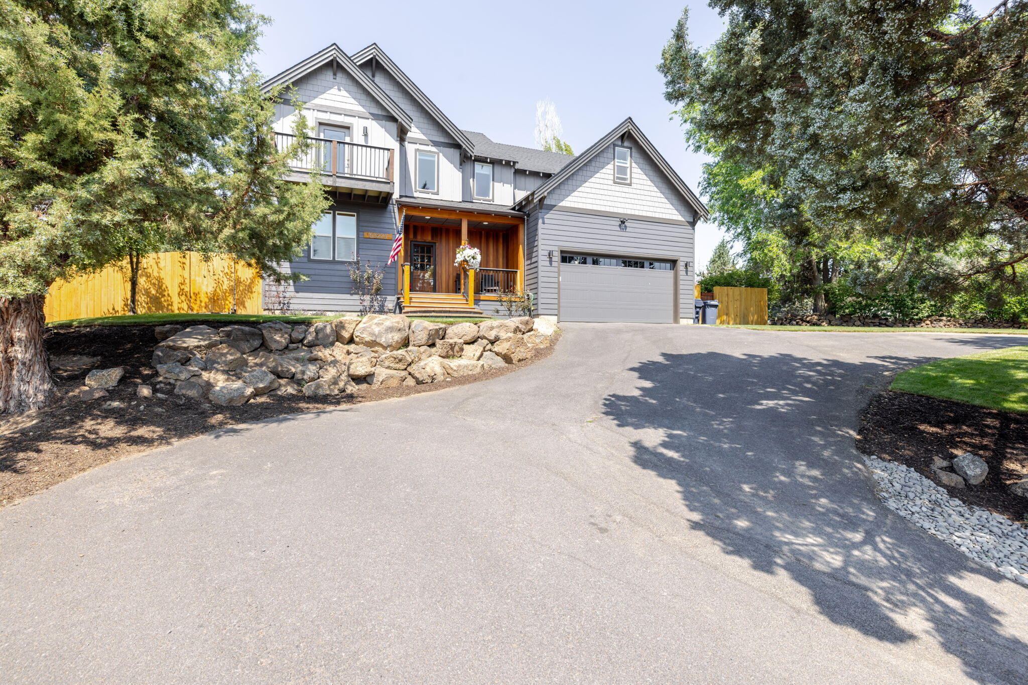 Perched on an expansive lot in the peaceful Boulder Ridge community, this well-maintained home offers stunning views of the Cascade Mountains, Pilot Butte and Smith Rock, along with privacy and everyday convenience. Thoughtfully designed with a versatile floor plan, the home features soaring 18-foot ceilings in the great room, a striking rock fireplace, and four spacious bedrooms—each with its own private deck.

The main level includes a dedicated office, ideal for remote work or study, while the chef's kitchen is equipped with rich cherry cabinetry, granite tile countertops, stainless steel appliances, and a custom stair railing that adds artistic flair. The luxurious primary suite feels like a private retreat, boasting a spa-inspired bathroom with upscale finishes.

Whether you're relaxing indoors or enjoying the natural beauty from one of the many decks, this home perfectly balances comfort, style, and spectacular scenery.