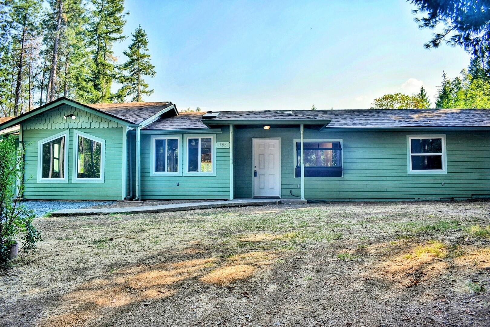 Single story home refurbished and updated in 2023! Recent updates include, new roof (now complete), new kitchen cabinet doors, interior paint, new doors, flooring, HVAC system, plumbing and electrical panel and fixtures, well pump, pressure tank, iron filter, appliances, too much to list! This 4 bed + office 3 bath house has a functional layout with possibility for a 2 dwelling/attached ADU setup. The open kitchen has 2 ovens, boasts 25 ft of counterspace to accommodate multiple cooks. The living room has a playroom with built-in cabinetry off to the side and 2 skylights. Master bedroom has a walk-in closet and 2nd laundry room. Many of the interior walls are insulated and have soundboard to minimize noise.   The 6.1 Ac property has 2 acres horse fenced, registered with ODF wildfire abatement program. There are multiple outbuildings: a 26x26 detached garage,  chicken house, goat shed, dog kennel, looped gated driveway. Spectrum high speed internet is to the driveway.