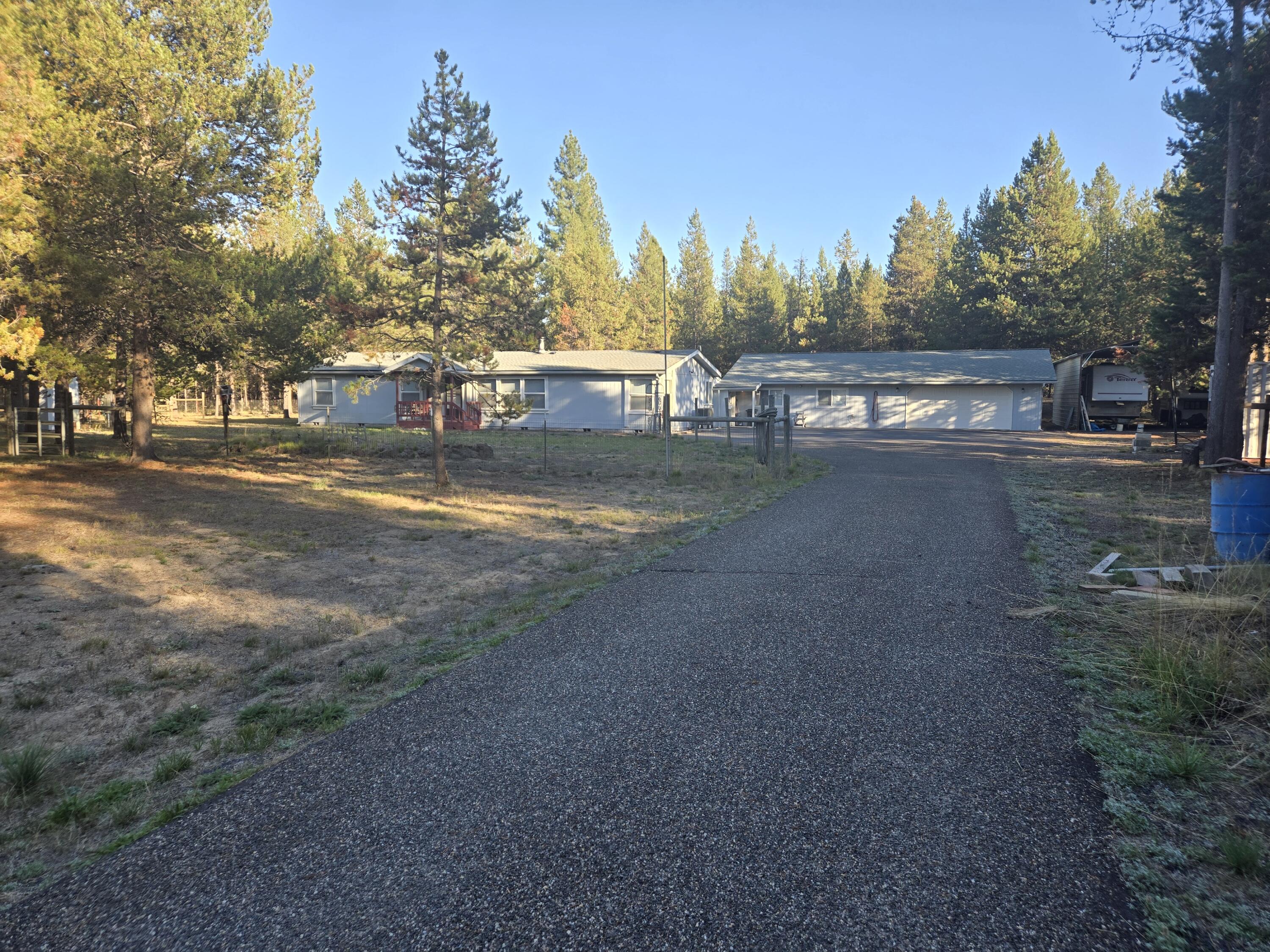 Huge Price Reduction!! This home is located in Lazy River South by the golf course.  Located on paved roads maintained by the county.  Home features are nice open floor plan with guest quarters off the garage.  Guest Quarters has 1 bedroom, bathroom, living room, guest quarters are 780 Sq Ft.  Home is 1782 Sq Ft with 4 bedrooms 2 baths, has living room and Family Room, in living room you will find a certified wood stove for those chilly nights. Master bath & master bedroom is right off the living room.  3 beds and family rm separation from master bedroom.  Dining room is open to the large Kitchen; There is a 50 year comp roof on the home and garage, new water filtration system.  Heat pump was added a couple years ago.  Outside you will find a front porch deck, out back has a large deck, several outbuildings, 2 car garage attached off the guest quarters.  RV cover is APX 30x40, Asphalt Driveway. Hot tub out back. fully fenced all on a cul-de-sac!!