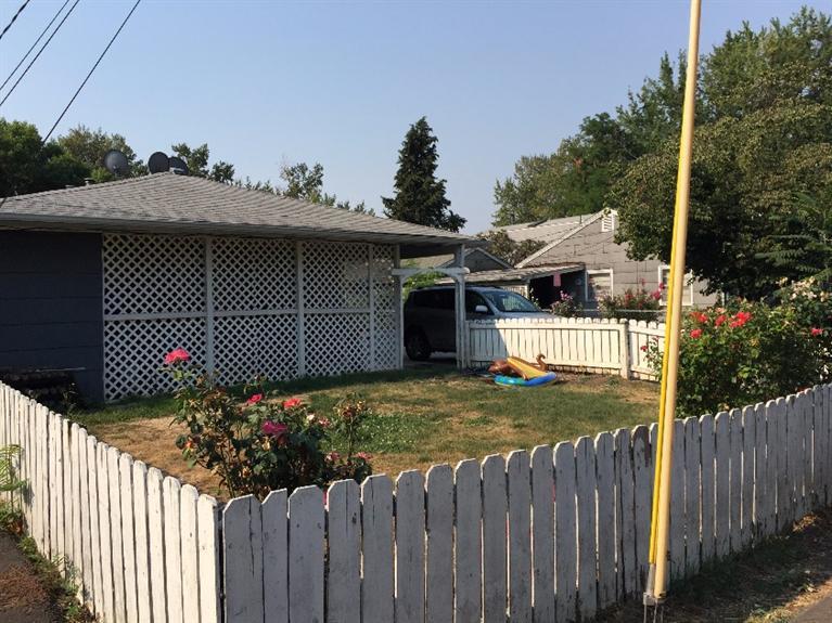 East Medford Investment Property with lots of potential! Great Opportunity at an affordable price. This duplex is located just blocks from downtown Medford, with easy access to S.O.U, RCC Campus and the library. Property has some deferred maintenance but the units are in good condition overall. Separate utility meters. Units are 2bed 1bath, and are approx 924 sq feet each. Attached carports. Large 0.27 acre lot which may provide room for an additional unit. Buyer to conduct their own due diligence with City of Medford for potential improvements.