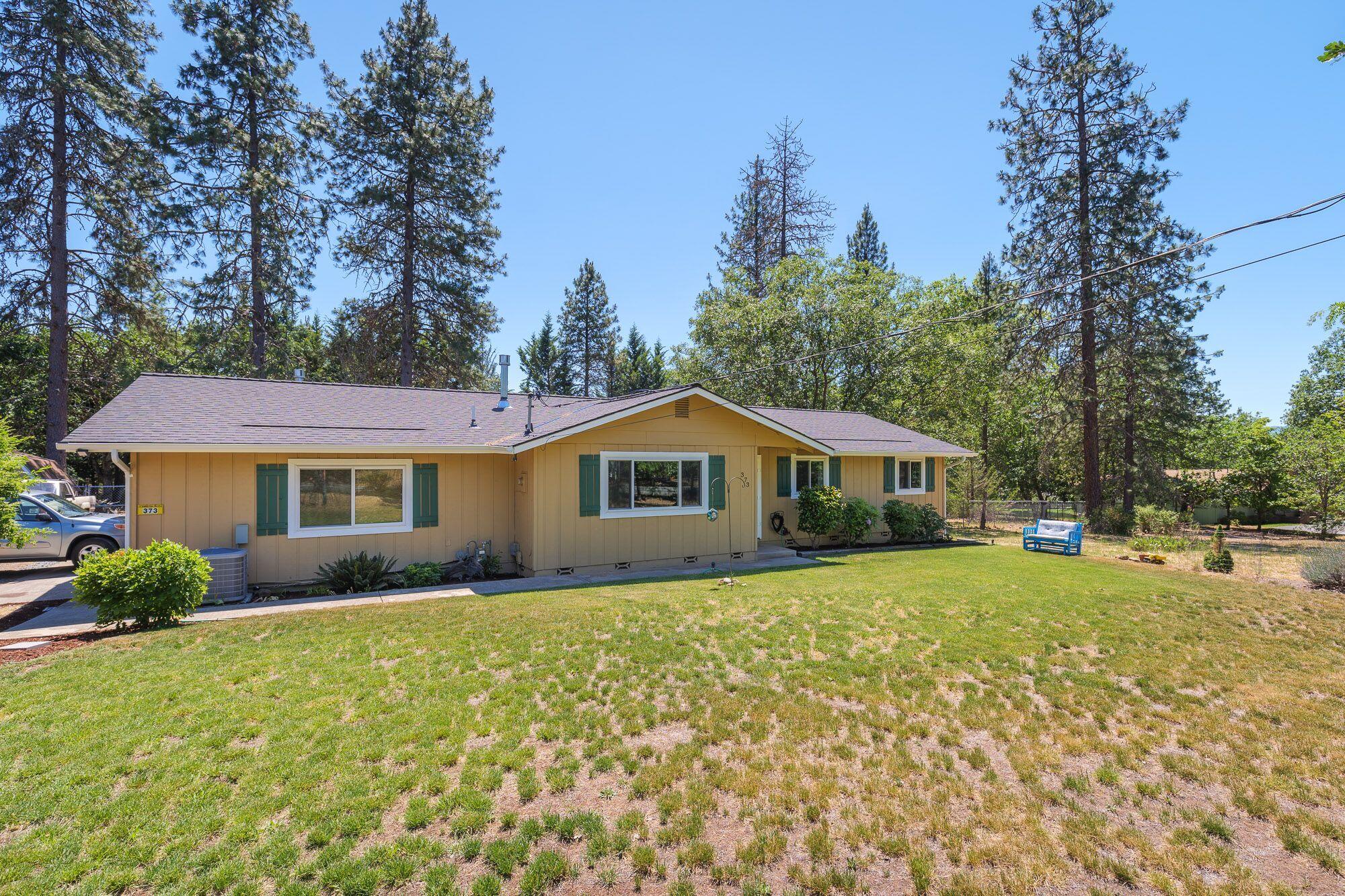 Versatile Country Charmer! Set in the desirable Colonial Valley & just minutes to town with an attached guest quarters w/ private entry great for in-law suite, 4th bedroom, office, potential rental or growing family. Turnkey ready w/ many recent updates: roof, gutters, windows, paint, bathrooms, & kitchen! Single-level main home has 3 beds & 2 baths w/ an open concept living space. Custom kitchen features modern cabinetry w/ deep drawers on the lowers & under mount lighting, artisan counters made of burl & colored resin, & a reclaimed wood adorned island on wheels. Living area boasts laminate floors, wainscoting, shiplap accent wall & a efficient natural gas stove. Attached guest quarters w/, en-suite bathroom & full kitchen w/ quartz counters, mini-split unit for heating & cooling as well as a natural gas stove, private deck & fenced yard. All on a flat .91-acre lot w/ fenced back yard & garden area, fruit trees, roses, shed, wildlife sightings, High-speed internet & low county taxes!
