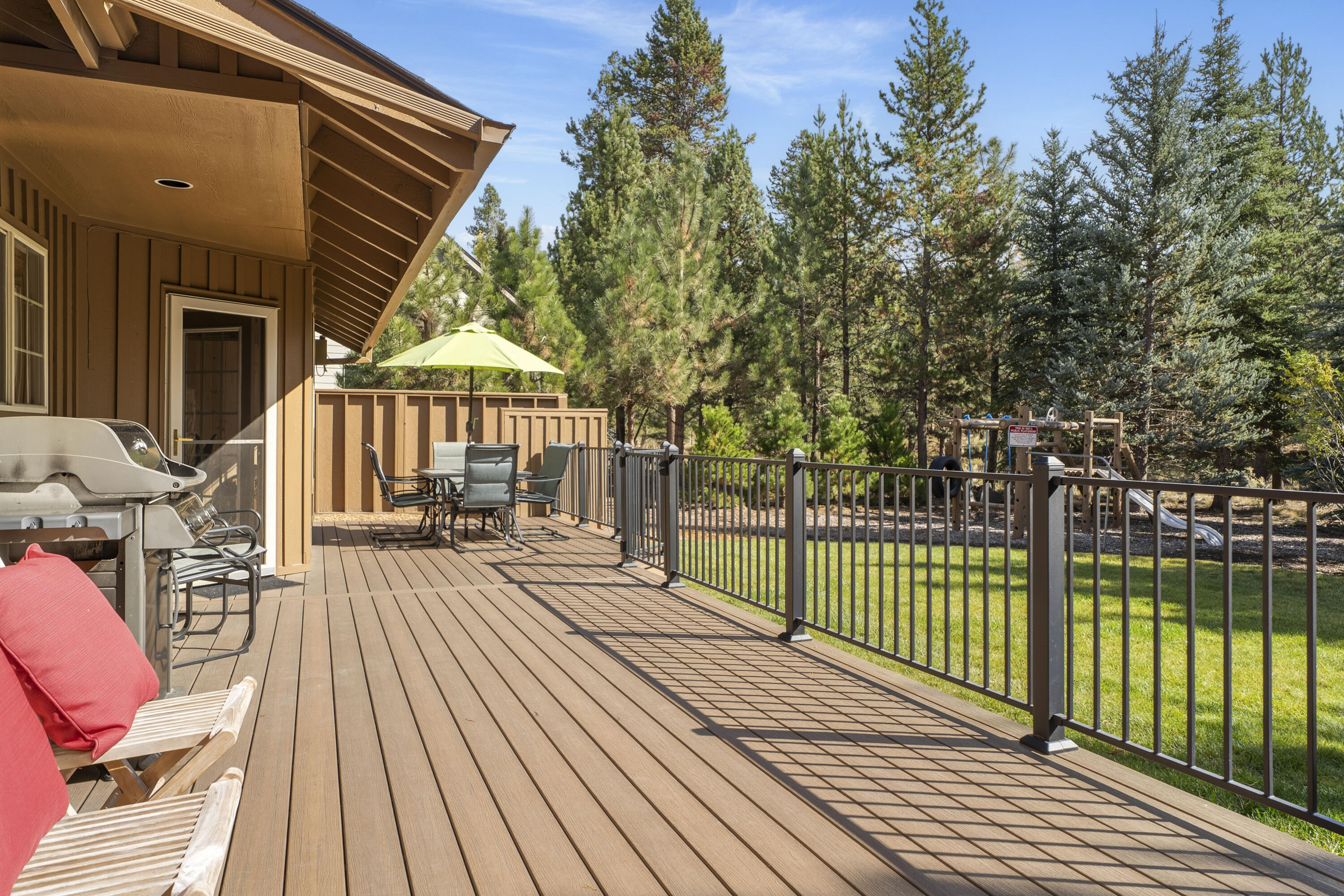 Discover this beautifully maintained, single-level Sunriver retreat full of charm. Tongue-and-groove pine accents & a double-sided gas fireplace between the living and dining areas create a warm, inviting cabin feel. With nearly 2,000 sq. ft. of living space, this 3 bed, 2 bath home also includes a versatile bonus room—perfect as a media room or add'l sleeping area with a gas fireplace.  Enjoy the spacious kitchen & adjoining dining area, ideal for gatherings. Step outside to a private, forested setting with a large, enclosed Trex deck, dog run, and private hot tub overlooking peaceful common space that connects directly to National Forest trails. The manicured backyard features a grandfathered-in play structure. Updates since 2021 include a new A/C, interior/exterior paint, furnishings, Trex Deck, hot tub & surround, ensuring this home is move-in ready. Conveniently located in the desirable north end of Sunriver w/ quick access to Cottonwood Road & Hwy 97. Furnished & ready to enjoy!