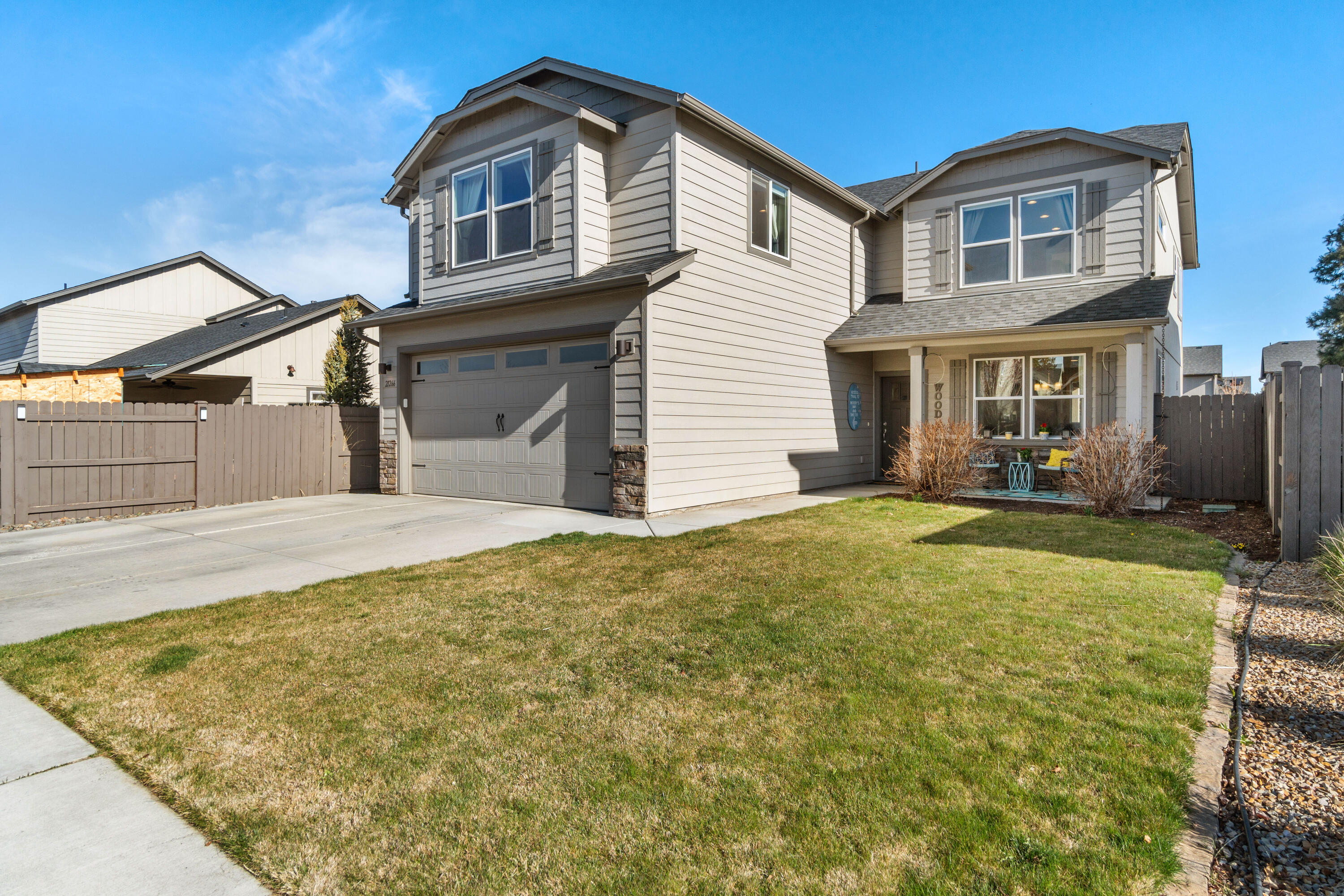 Incredible home with open floor plan, perfectly located between trails, park and future Cascade Lakes Brewing! Come see this better-than-new home with engineered wood floors throughout the lower level. Formal dining just off the entry could also serve as an office. Huge living and kitchen space is an entertainers dream - dual fuel range for the chef, custom reclaimed oak island countertop seats 6, all overlooking the expansive back yard. Covered patio and built in fire pit will get used year round! Storage shed and play structure included. On your way upstairs you'll find what you never knew you always wanted...a masterpiece of art and entertainment in a 12 ft climbing wall! The front stairs take you to a huge bonus room with peak-a-boo views. To the rear of the home are primary bed and ensuite, two additional bedrooms, full bath and laundry. Extra deep garage (24') with 8' door allows a full size truck to park and store all of your gear. Start living your Bend dream today!