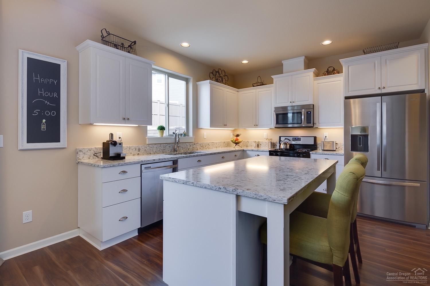 Beautiful, bright, award winning Samson townhome in McCall Landing is less than a block to Boyd Park. Almost new Pahlisch townhome features 3 beds, 2.5 baths, a large vaulted loft with skylights, and a cute built-in desk off the open kitchen. This home has upgraded quartz counters, white cabinets, extended concrete patio, front screen door and more. Home is only attached at the garage, powder bath and kitchen wall - no bedrooms or living spaces are attached! Home has some mountain views from the upstairs.
