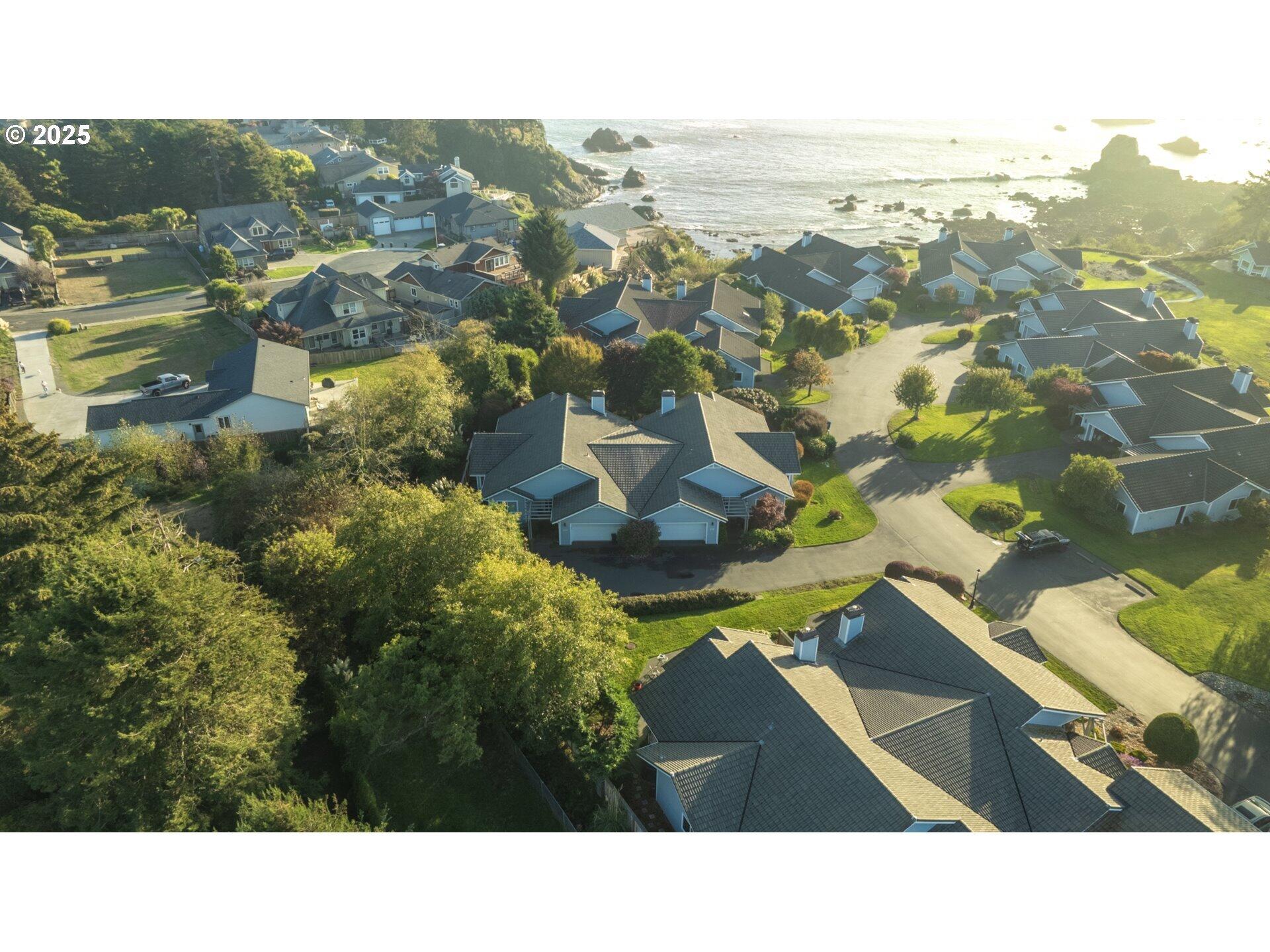 Seaside Living at The Cove! This gated community offers direct beach access, a private walking path, a gazebo just for residents, beautifully maintained common areas, and even a community garden. The townhome itself includes 3 bedrooms and 2 baths, with the third bedroom thoughtfully designed as a custom office complete with built-ins. Inside you'll find quality finishes throughout—granite counters and stainless steel appliances in the kitchen, travertine in the bathrooms, rich wood cabinetry, and tile flooring in the main living spaces. The primary suite offers an en-suite that includes double vanities, two walk-in closets, walk-in shower and tub. Exterior maintenance is handled by the HOA, giving you more time to enjoy the coast.