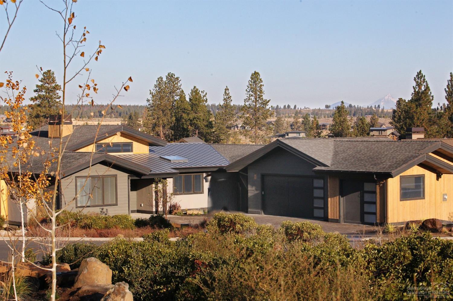 Price Reduced! This Contemporary Northwest custom designed home offers stunning views & a prime location in Tetherow's Cascade Vista neighborhood, built by Greg Welch, one of Central OR's leading builders. This home has 3 ground level bedrooms, 3.5 baths, a large downstairs bonus room w/ dry bar that can double as the 4th suite, an ample mudroom, office, & over 3,100 SF of living space on a mountain view lot. Not only is this home designed w/ contemporary finishes, light & bright spaces and a thoughtful floorplan to maximize views & livability, it also is situated in a prime Tetherow location allowing easy access & close, biking proximity to award winning schools, Bend's westside & vibrant downtown. While Bend has consistently been named one of the best places in the country to live, Tetherow Resort & community could be the best place to live in Bend, comprised of 700 acres on the desirable westside.