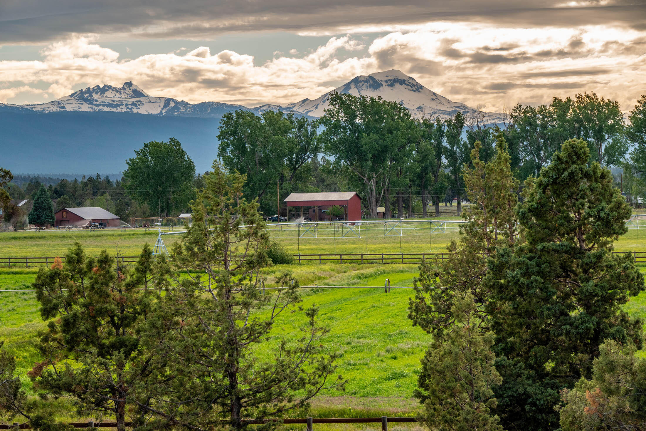 Deschutes River Ranch is one of Central Oregon's most unique developments to conserve farmland and wildlife areas while providing scenic home sites for discerning buyers. The Wild Horse Trail Farm is a 2-parcel offering of a 5.83± acre lot consisting of rugged high desert terrain with juniper trees and moss-covered lava rock, an elevated home site that boasts the view of Cascades, as well as 25.45± acres with 15± acres of irrigated forage production. Building sites in DRR are known for epic views and settings. As part of the DRR, you can enjoy private community access to over a mile of the scenic Deschutes River and an extensive network of trails for hiking and equestrian use; additionally, the ranch trails border the land-locked BLM land with miles of trails. All this in the desirable Tumalo area. The Wild Horse Trail Farm awaits your visions of exceptional living and enjoyment of the land today!