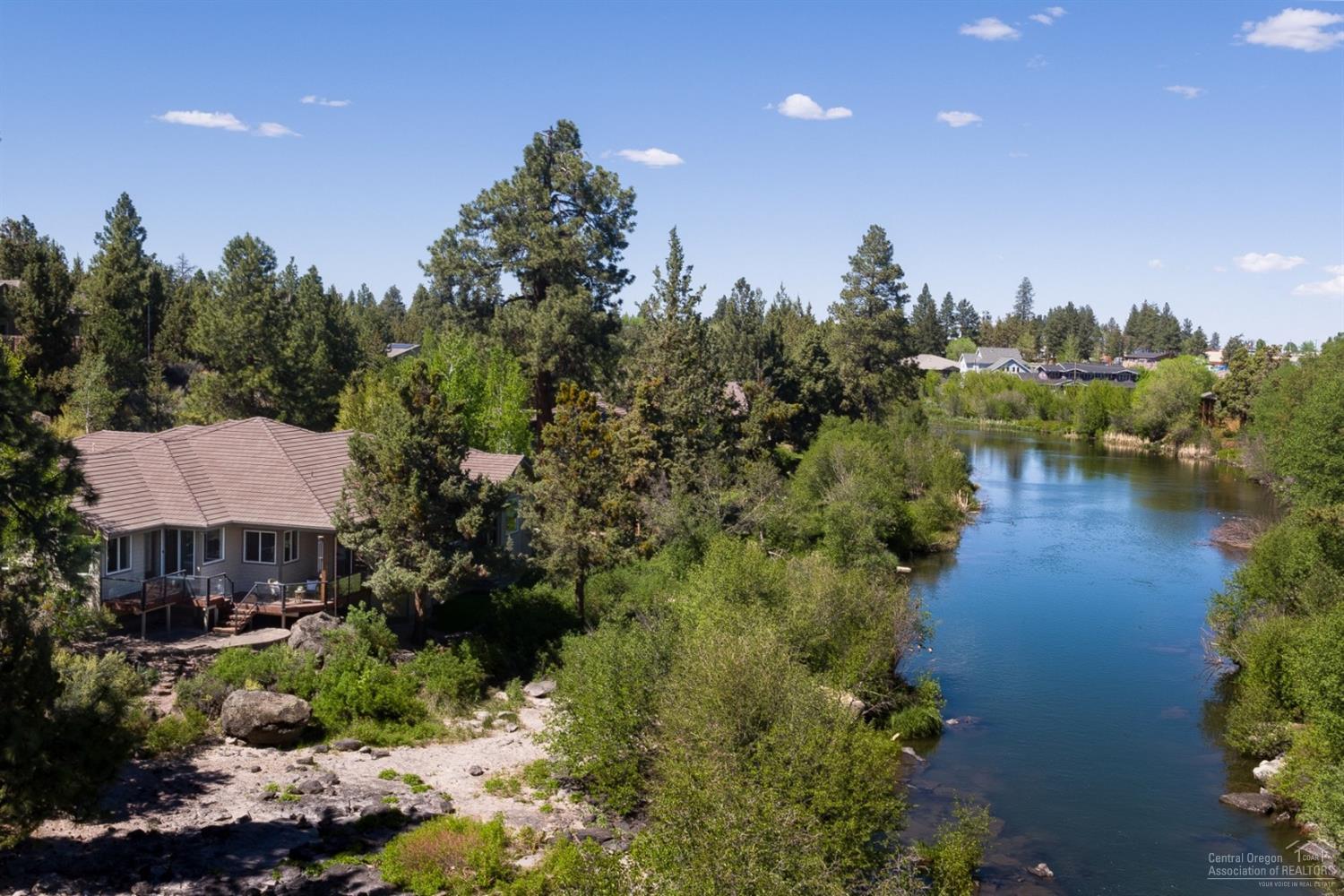 Rare opportunity to live on the Deschutes River in Bend! This beautiful custom Single Level Home offers an open concept floor plan, stunning river frontage and views. Updated Kitchen features new Appliances. Large Master affords river view. Fly fish, bird watch and enjoy the serenity of the River from almost every room in the home. In addition to 3 bedrooms, the home offers an Office, a Media Room and a third flex room. A large, two level deck highlights the outdoor living space and 200' of river frontage.