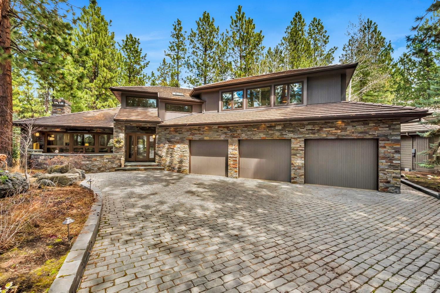 This stunning completely renovated home in Broken Top is nestled on a quiet and private lot. Revel in the custom cabinetry throughout as well as a magnificent kitchen with a large marble island that opens to the great room. The gorgeous master bedroom is located on the main floor with french doors that open to the outdoor living area. Upstairs discover two guest bedrooms, a full bath and a bonus room with an attached bath that can also be utilized as a junior suite. The patio heaters located under the covered dining area along with the built in gas grill allow for many relaxing evenings outdoors.