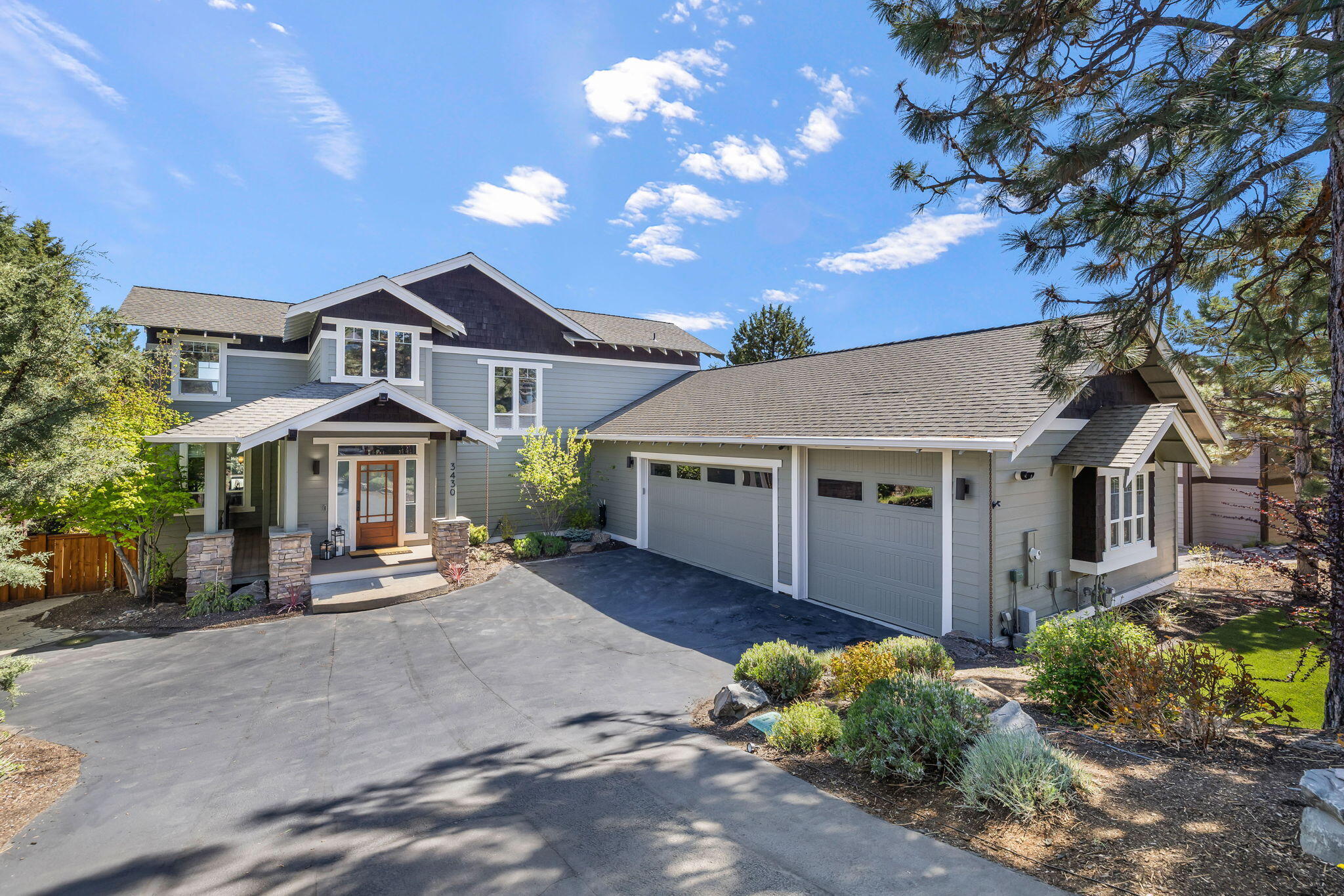Welcome to Awbrey Park, where style meets function in this beautifully remodeled home. Step into the grand 2 story entry and living room with floor to ceiling windows. The luxurious main-floor primary suite offers double vanities, a soaking tub, dual head oversized shower and walk-in closet. Enjoy elegant dining and a brand new custom chef's kitchen with high end appliances and stunning finishes. Upstairs, a spacious bonus loft space connects two large bedrooms. The 3-car garage features a 10' door and heated driveway—ideal for recreational vehicles. Perfect for indoor-outdoor living and entertaining, the home features over 1000 square feet of deck space, hot tub, patio seating, and a fenced yard for privacy. Don't miss the extra storage space under the home, ready to be transformed into a studio or in-law apartment. Located in a quiet neighborhood on Bend's prestigious northwest side, just a short walk to Sawyer Uplands park and Deschutes River Trail!