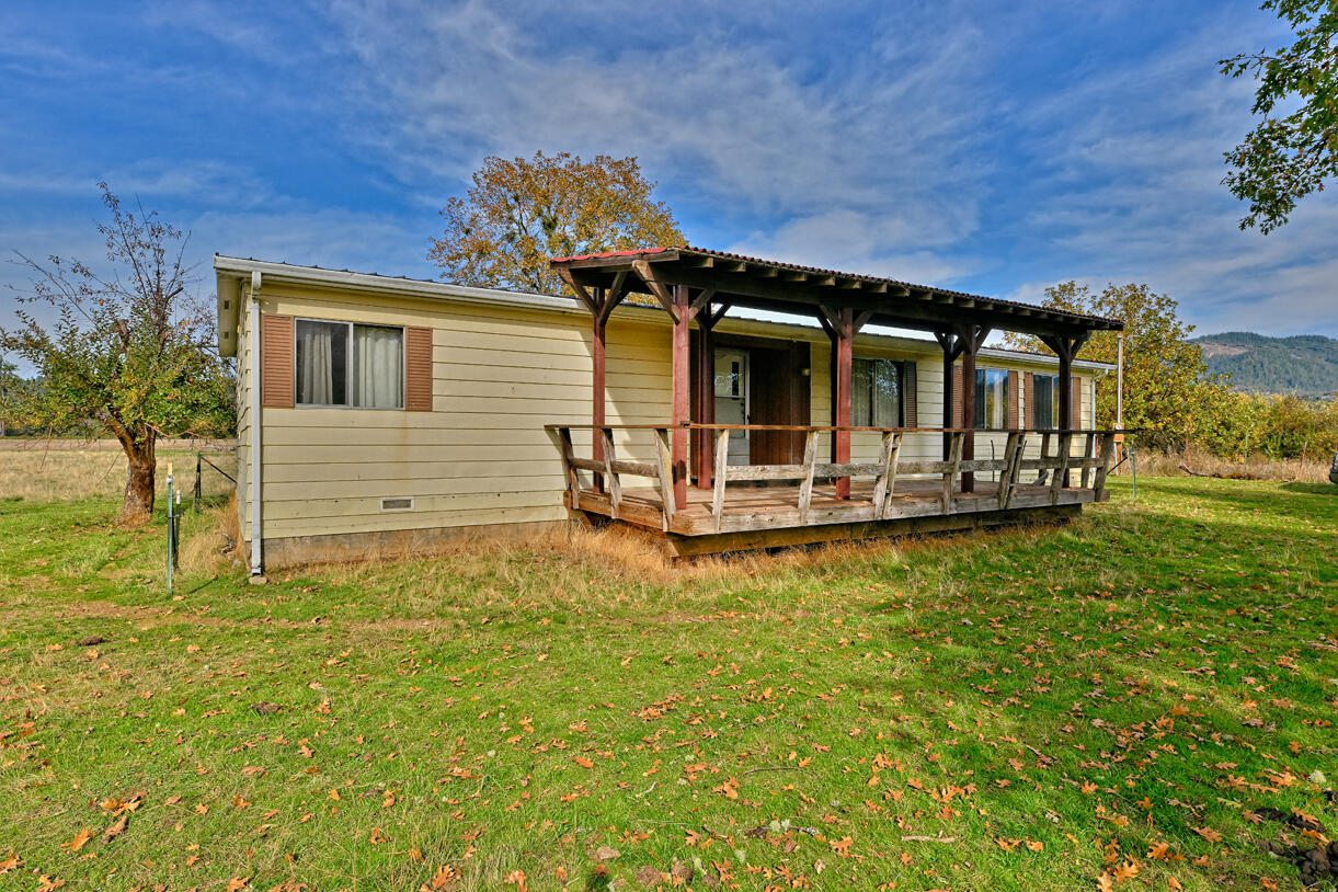 1981 Manufactured home on 2.7  exclusive farm acres.  Country living with just enough land to manage a mini farm.  Beautiful views and area.  The home features a large front deck, open pasture, fenced and an original hardwood barn.