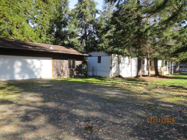 Level and usable- Open meadow trees, and all usable. Great property with an older single wide. Features a 2 car garage. Live in mobile while you build. All information deemed reliable but not verified. Anyone interested in the purchase of this property should perform their own investigation into the use and condition of property.