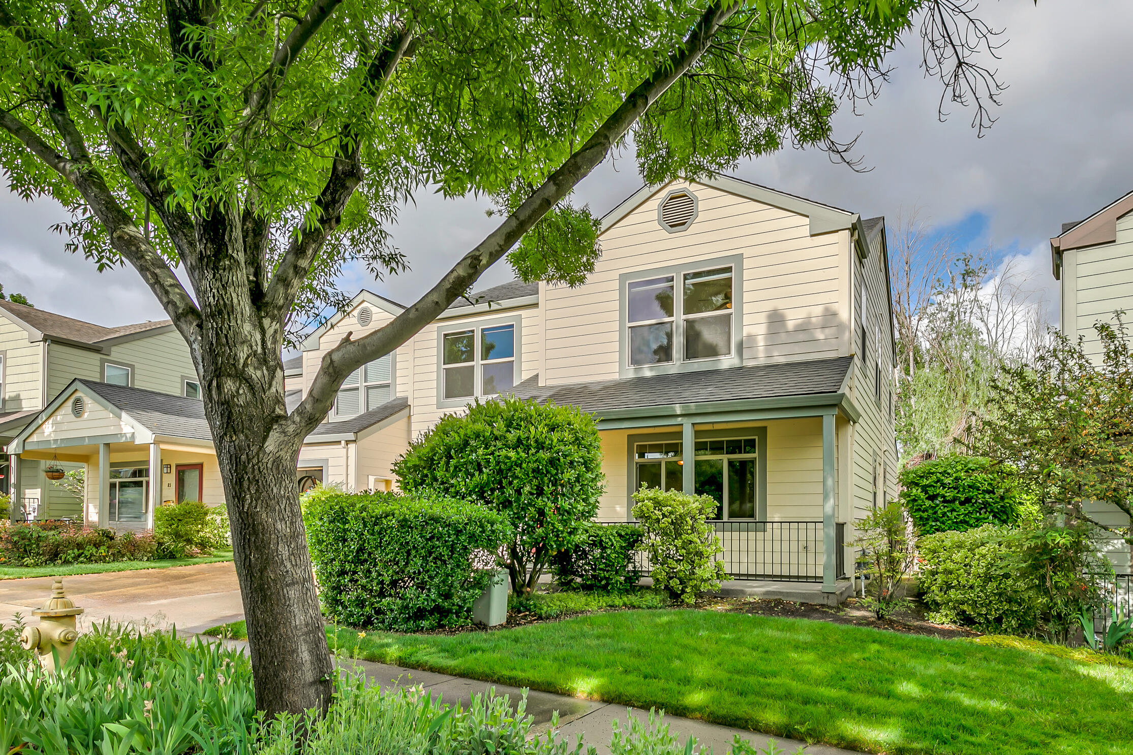 Move-in-ready townhome with serene views across 6.5+ acres of contiguous green space proposed as future site of East Main Park by Ashland Parks & Recreation! Main level with wide-plank oak floors, dining area with sliding glass door to fully fenced back yard with mature plantings and expansive composite deck, kitchen with solid surface dining counter, four-burner natural gas range, microwave hood, dishwasher and stainless steel dishwasher, adjacent pantry closet, laundry room with washer and dryer, half-bath powder room, and one-car garage with built-in shelving. Upper level with low-pile Berber wool carpets, primary bedroom with ceiling fan, walk-in closet, full ensuite bathroom with double vanity and shower, two spacious guest bedrooms with closets, and full guest bathroom with tub shower. Association dues of $173 per month cover landscaping maintenance and water for front yards and approximately three acres of common areas. Inquire for additional documentation and details!