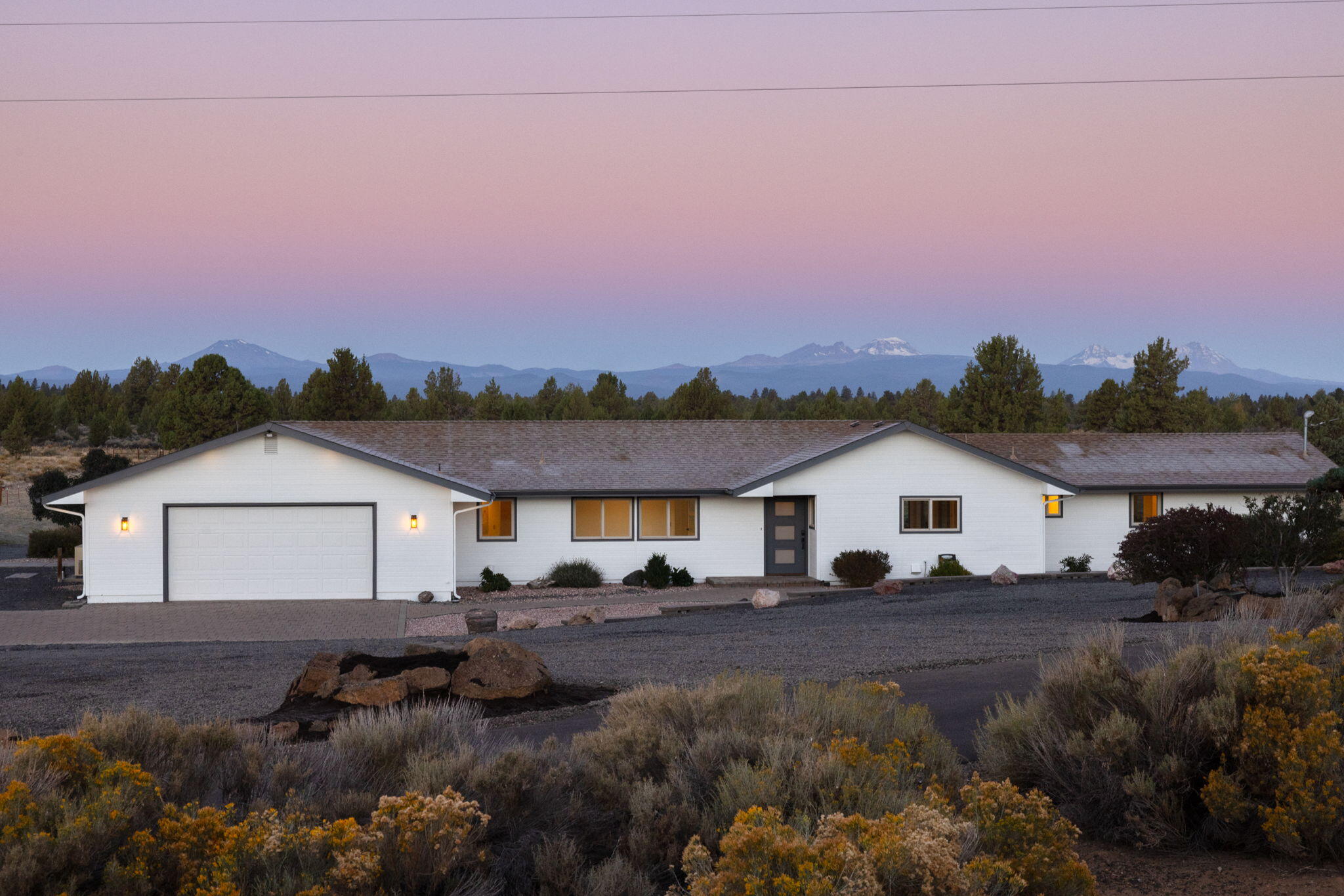 Wow! This one-of-a-kind 5.3-acre property offers stunning Cascade Mountain views and a brand-new, permitted 727sq. ft. addition—ideal as a guest space, studio, or hangout room. Fresh paint, new floors, and updated doors throughout. With 3 bedrooms, 3 baths, and a bonus suite, there's room for everyone. The main suite features a walk-in shower, spacious closet, and built-ins. Cook and entertain in the generous kitchen while soaking in the views, then unwind on the large patio overlooking the irrigated pasture with underground sprinklers. Avion domestic water. A new furnace, heat pump, and Generac 25kW backup generator ensure year-round comfort. Two 16x20 sheds, a fenced garden, and plenty of space for RVs and toys. Just 8 miles from downtown Bend—privacy, comfort, and mountain magic all in one. Access via Gosney Road for asphalt all the way to the house.