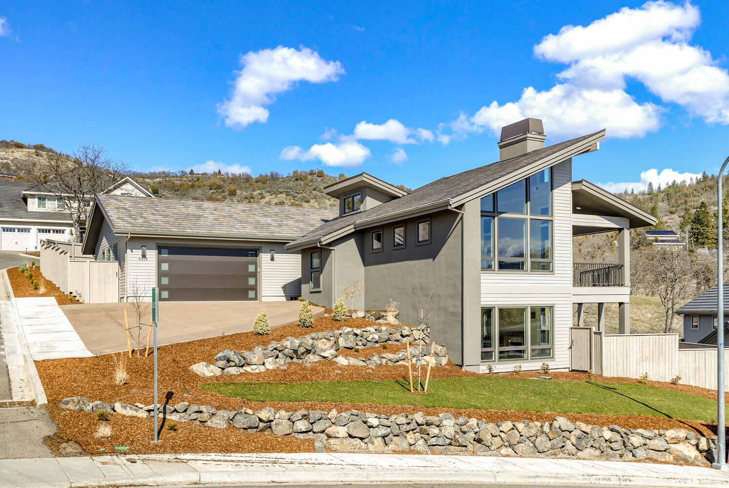 Beautiful views of the valley from this new contemporary style home located in the premier Saddle Ridge development.  The great room has high vaulted ceilings and lots of glass to enjoy the views and abundant natural light.  Large, island kitchen with Kitchen-Aid appliances, quartz counters and a pantry.  The reverse living floor plan has the master suite on the main level.  The lower level has 3 bedrooms and a family/bonus room.  There is a huge, incredible deck that is an amazing outdoor living space.  Two gas fireplaces.  The two car garage is oversized.  All fenced and landscaped.  Earth Advantage certified for energy savings and reduced utility costs.
