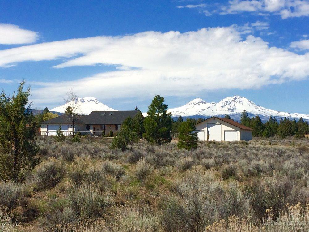 Stunning Mountain Views! Charming 3 bedroom, 3 bath, 1,567 sq. ft. home on 1.39 acres located in Ponderosa Cascade Community, Sisters School District, convenient location between Sisters and Bend. Huge 1,440 sq. ft. RV/Storage shop for all of your toys! Covered back porch and deck to enjoy the expansive Cascade mountain views.