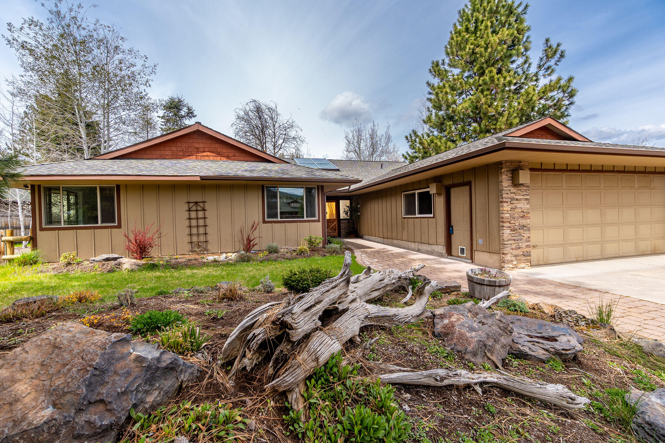 FIREWISE NEIGHBORHOOD! Welcome to the sought after Metolius Meadows neighborhood in Camp Sherman, OR. This single story ranch home provides 2,242 sf of open floor space.  4 bedrooms, 3 full baths, built in 1970 with improvements throughout. Vaulted Pine ceilings, skylights, large windows and wood burning stove in living room.  Kitchen remodeled in 2017; new cabinetry, quartz counter tops, tile backsplash, radiant heated tile flooring, and stainless steel appliances.  The primary is located apart from the additional bedrooms and features a walk-in closet, private bath with tile walk-in shower, and dual vanity with granite countertops.  Large laundry room has ample storage located off of the 2 car garage with enclosed workshop. A birds lovers paradise in the fenced backyard that backs up to common area. Yard is landscaped and complete with arbor seating area and freestanding fire pit.  Neighborhood amenities include community pool, tennis court and walking trails. *New carpet 6/2024