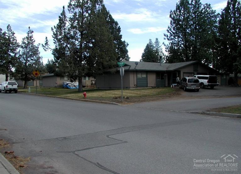 Six unit complex consisting of three 1977 vintage duplexes on nearly 2/3 acre in great central Bend location near Old Mill District. Clean, single story, ranch style units with 2 bedrooms, 1 bath, washer and dryer hookups, and single car garage for each unit. Great bones in a great location for a great opportunity.